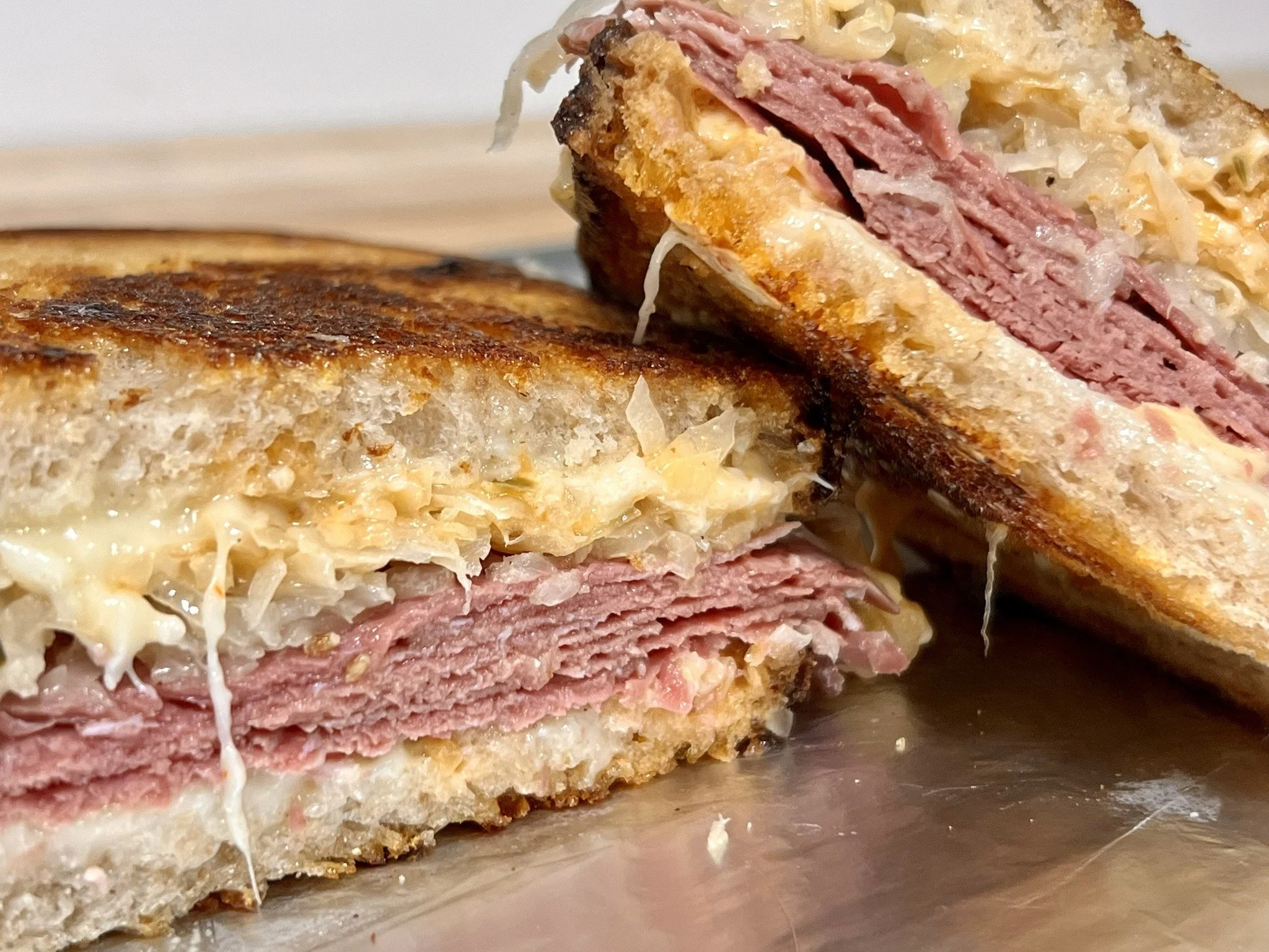 Best Reuben in town. We said what we said.

House-cured LaPlatte River Farm corned beef, swiss, Pitchfork pickle kraut, and Crazy Ivan sauce on griddled O Bread French country sourdough. Crispy, melty, tangy, messy perfection.