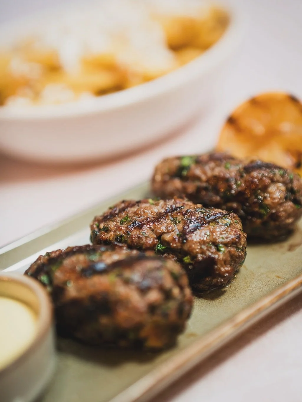 There&rsquo;s something special about the smell of the grill&hellip;that smoky, charred flavour that feels like summer in Greece 🇬🇷

Juicy souvlaki, tender lamb chops, homemade beef patties&hellip; all cooked over flame and made to share. 

Add a l
