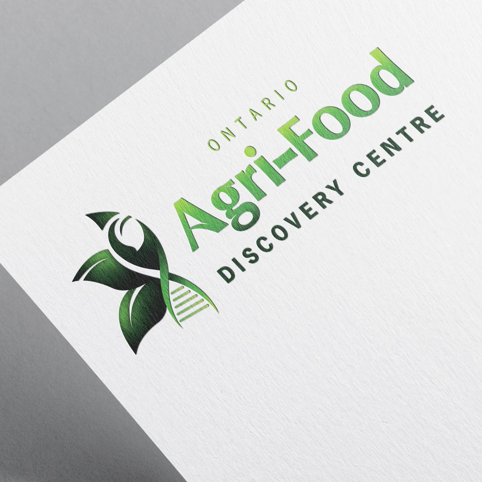 Logo for Ontario Agri Food Discovery Centre featuring green leaves and a stylized DNA strand