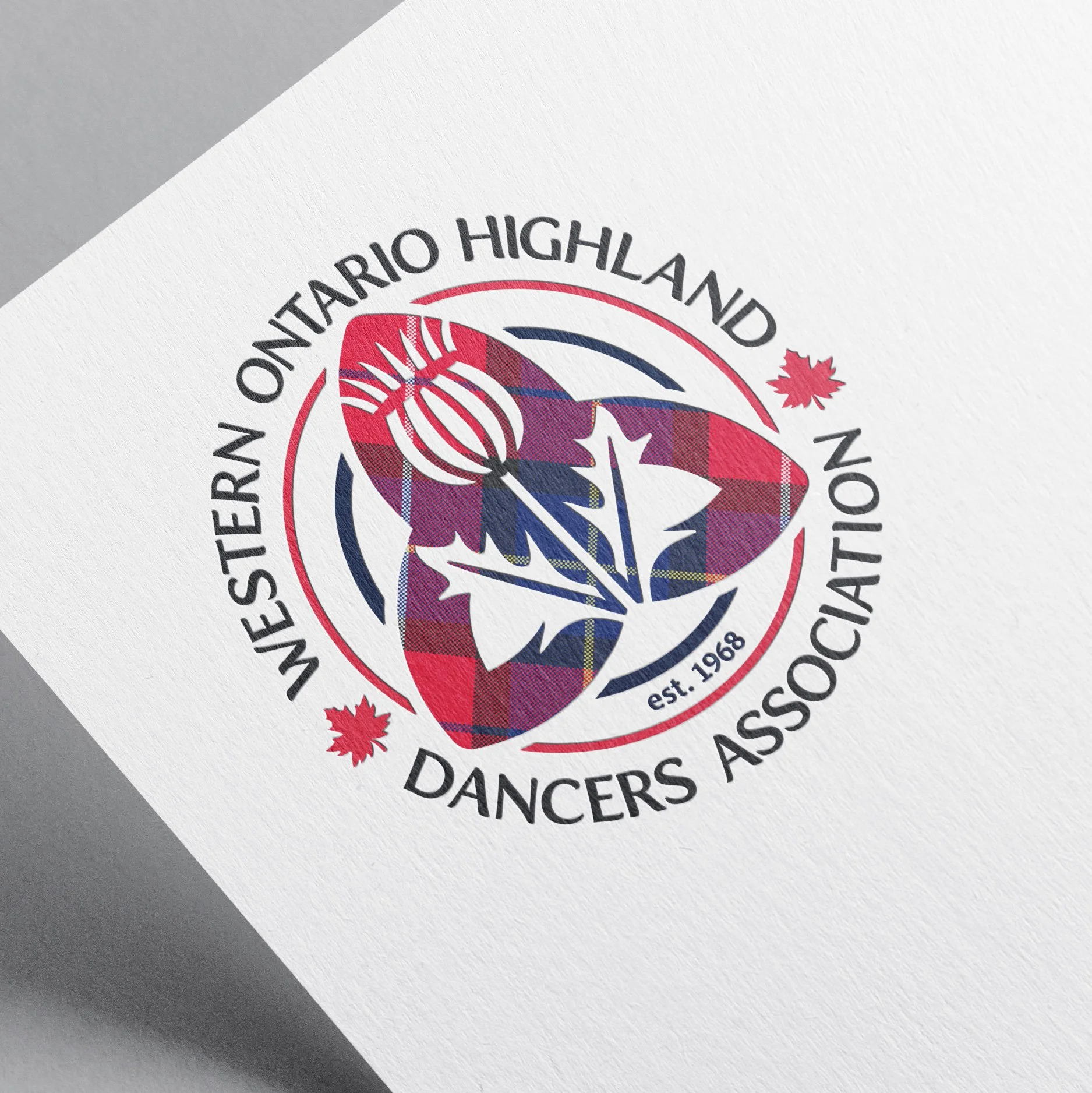 Logo of the Western Ontario Highland Dancers Association, featuring a red and blue tartan pattern, a maple leaf, and a dancer silhouette.
