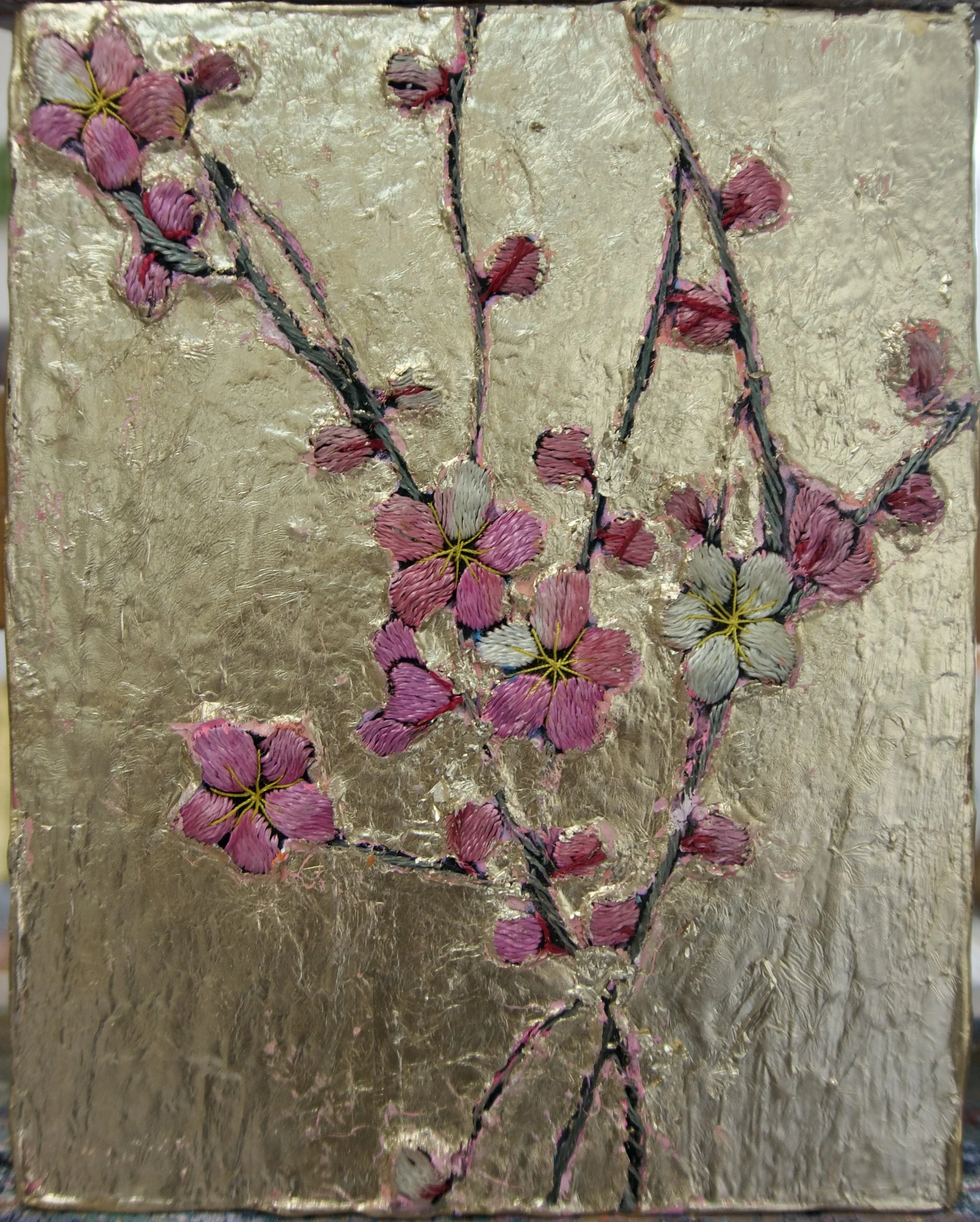 Natasha Zupan - Afterglow #28, mixed media collage with fabric, gold leaf and cherry blossom floral in the center