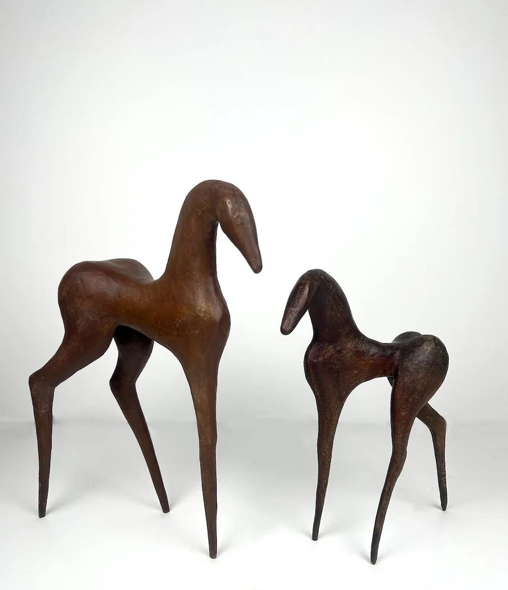 Tolla Play Horse, two abstracted bronze horses, each with three legs, one larger than the other