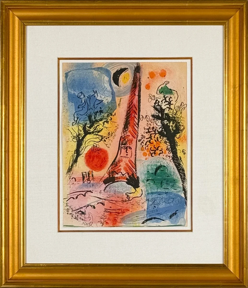 Marc Chagall Vision of Paris, framed - lithograph printed in rainbow colors with scene of the Eiffel tower and landscape