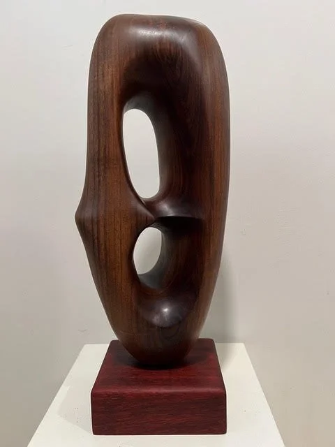 Fermin Castro Diaspora III, abstract black walnut wood sculpture and base
