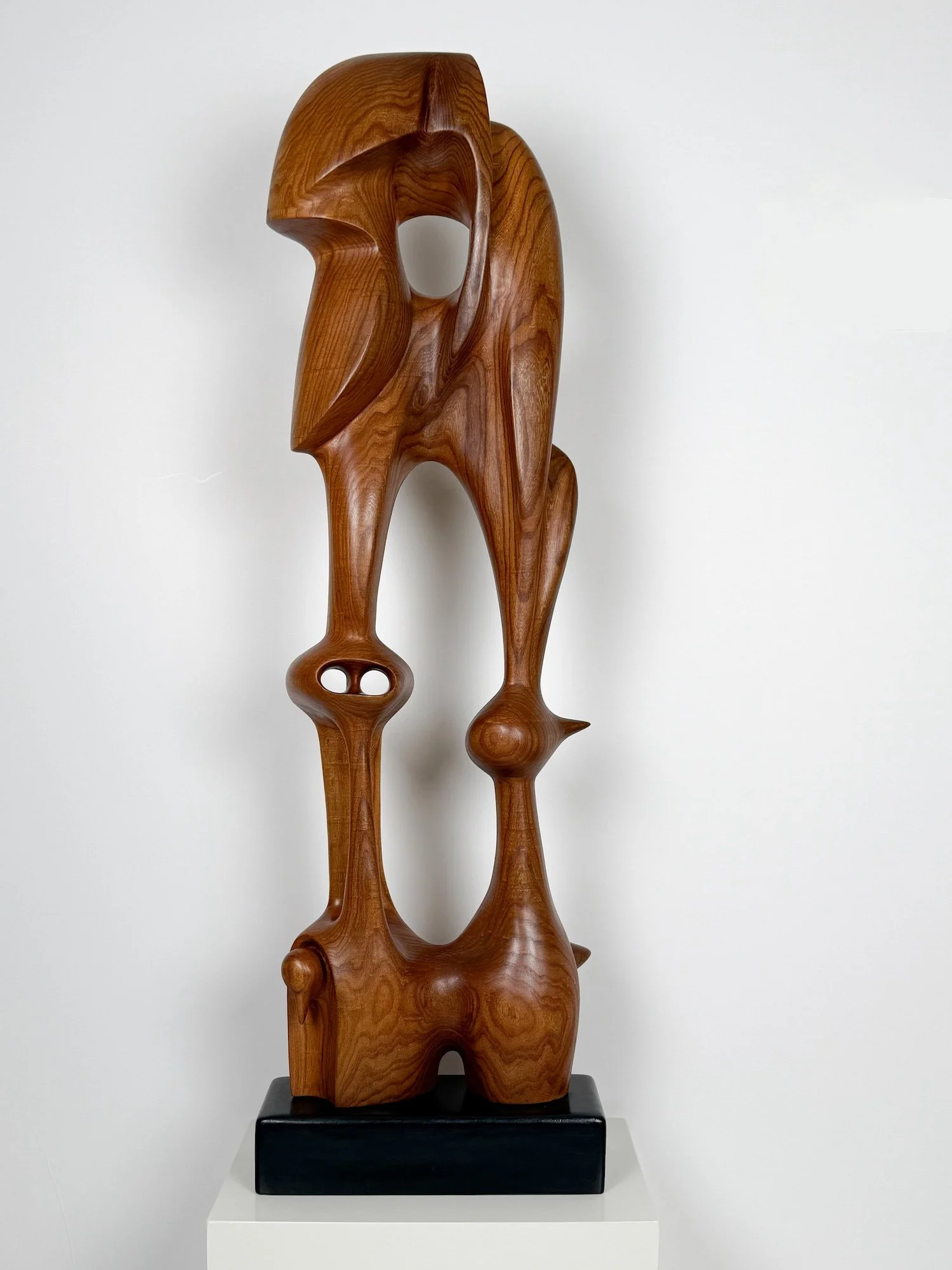 Fermin Castro - protector of the fantasies, abstract standing wooden sculpture, red elm