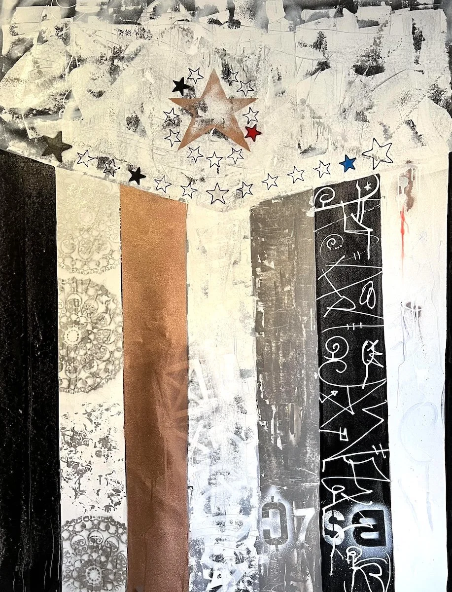 Abstract artwork with vertical stripes of black, white, metallic, and brown paint, decorative patterns, and a black section with white mathematical squiggles. Hanging from the ceiling is a star-shaped decoration made of metallic and paper stars in white, black, red, and blue.