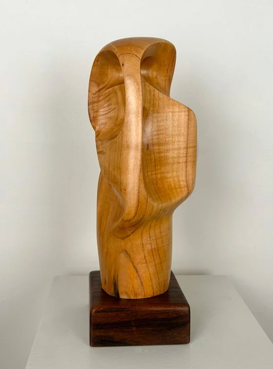 Fermin Castro  Solemne, abstract wood sculpture, smooth curved shape with openings sitting on square base