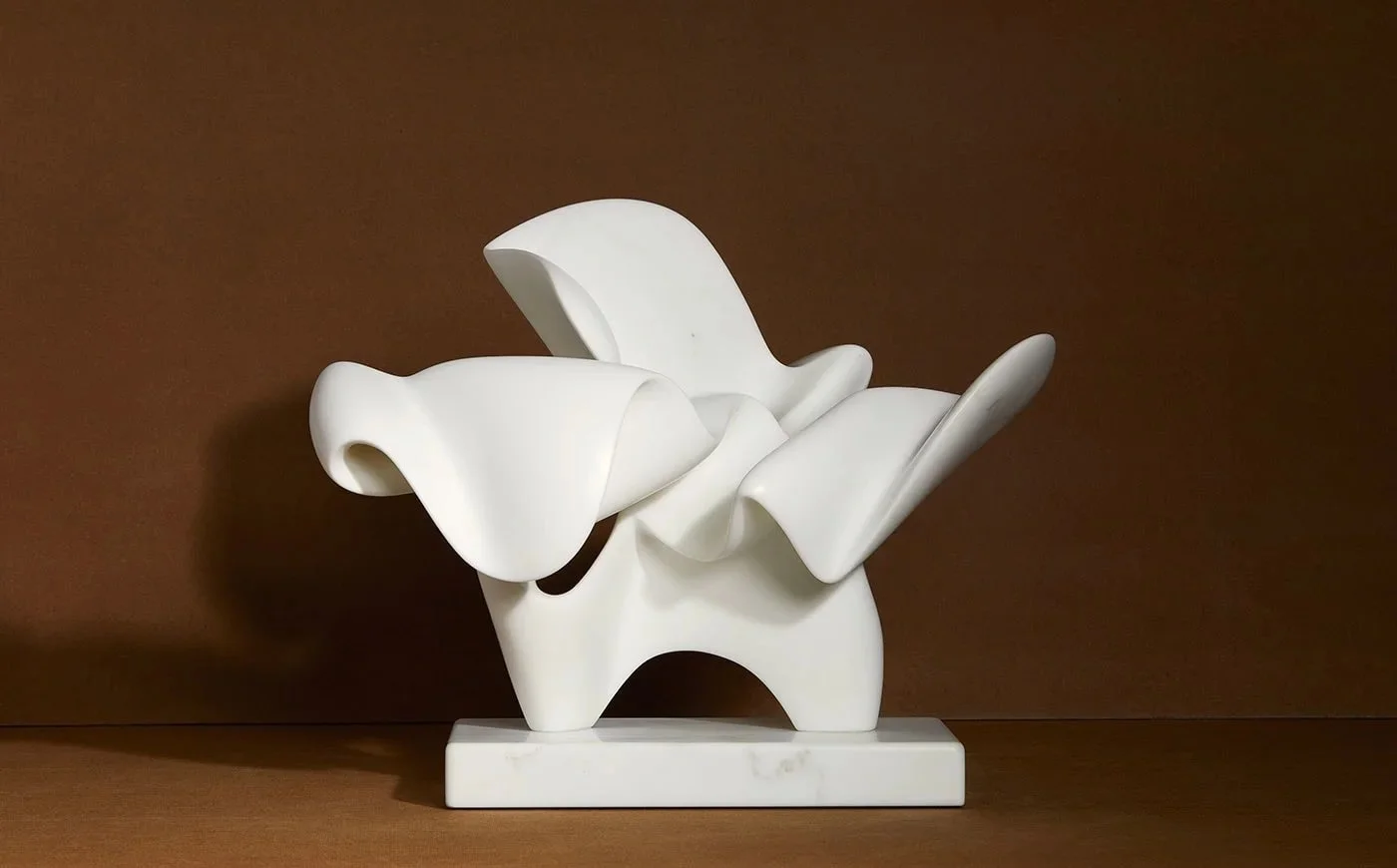 Richard Erdman Momenta, An abstract white flowing sculpture made from carrara marble