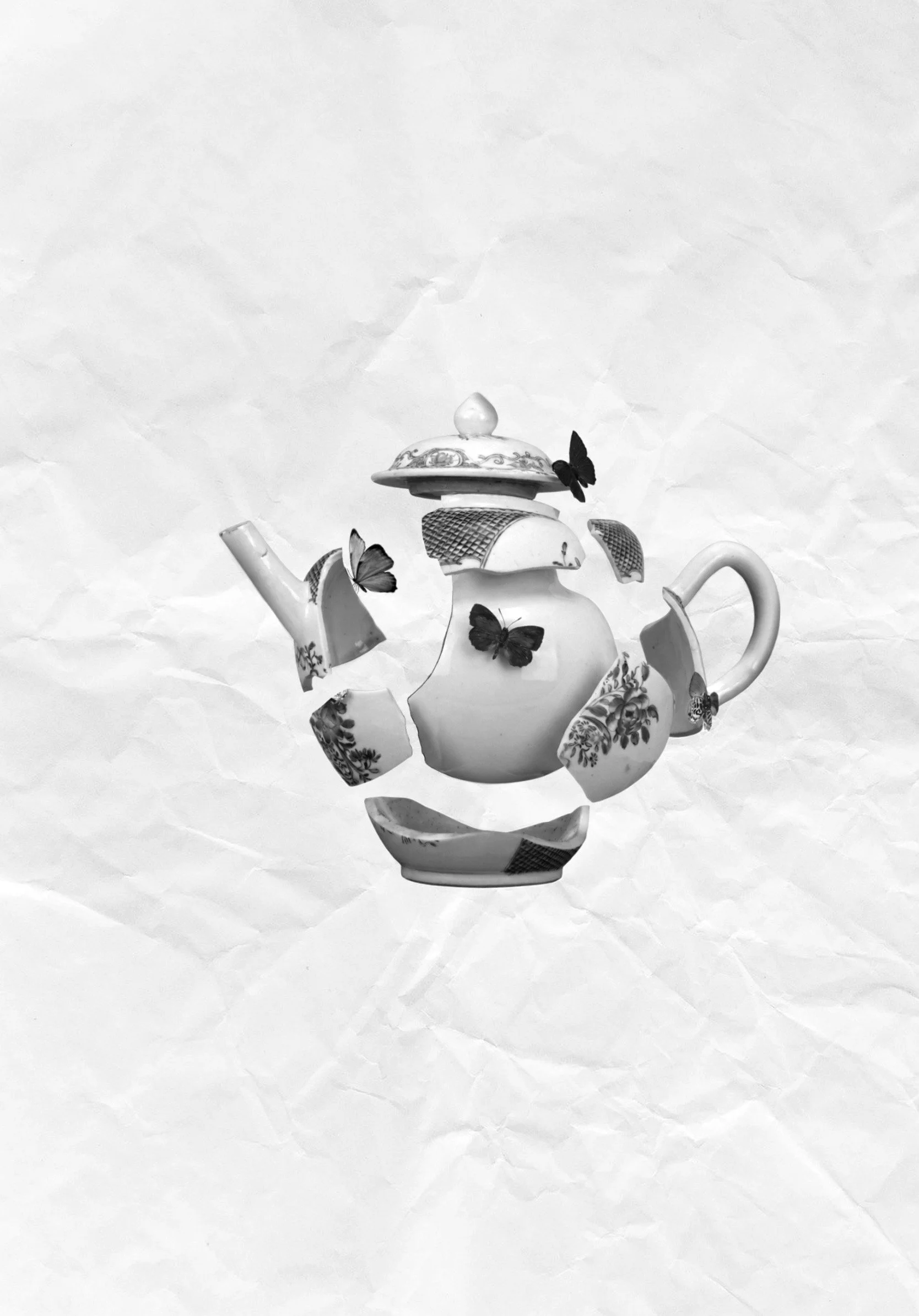 Design of a vintage broken teapot with butterflies flying around its pieces created by tattoo artist in Vienna.