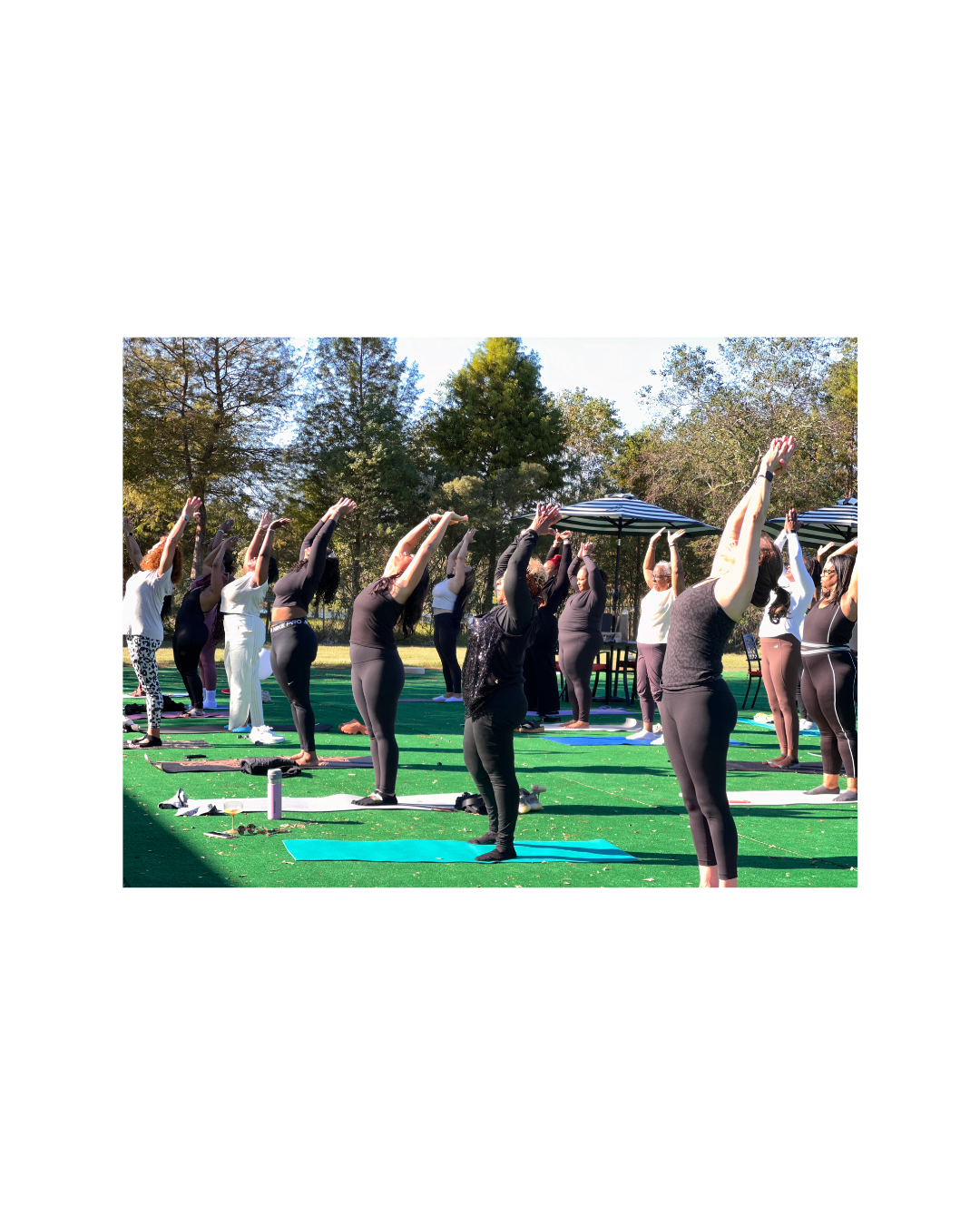 Ladies doing yoga on artificial turf