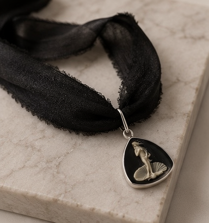 Black silk Venus cameo choker with raw-edge ribbon and silver setting