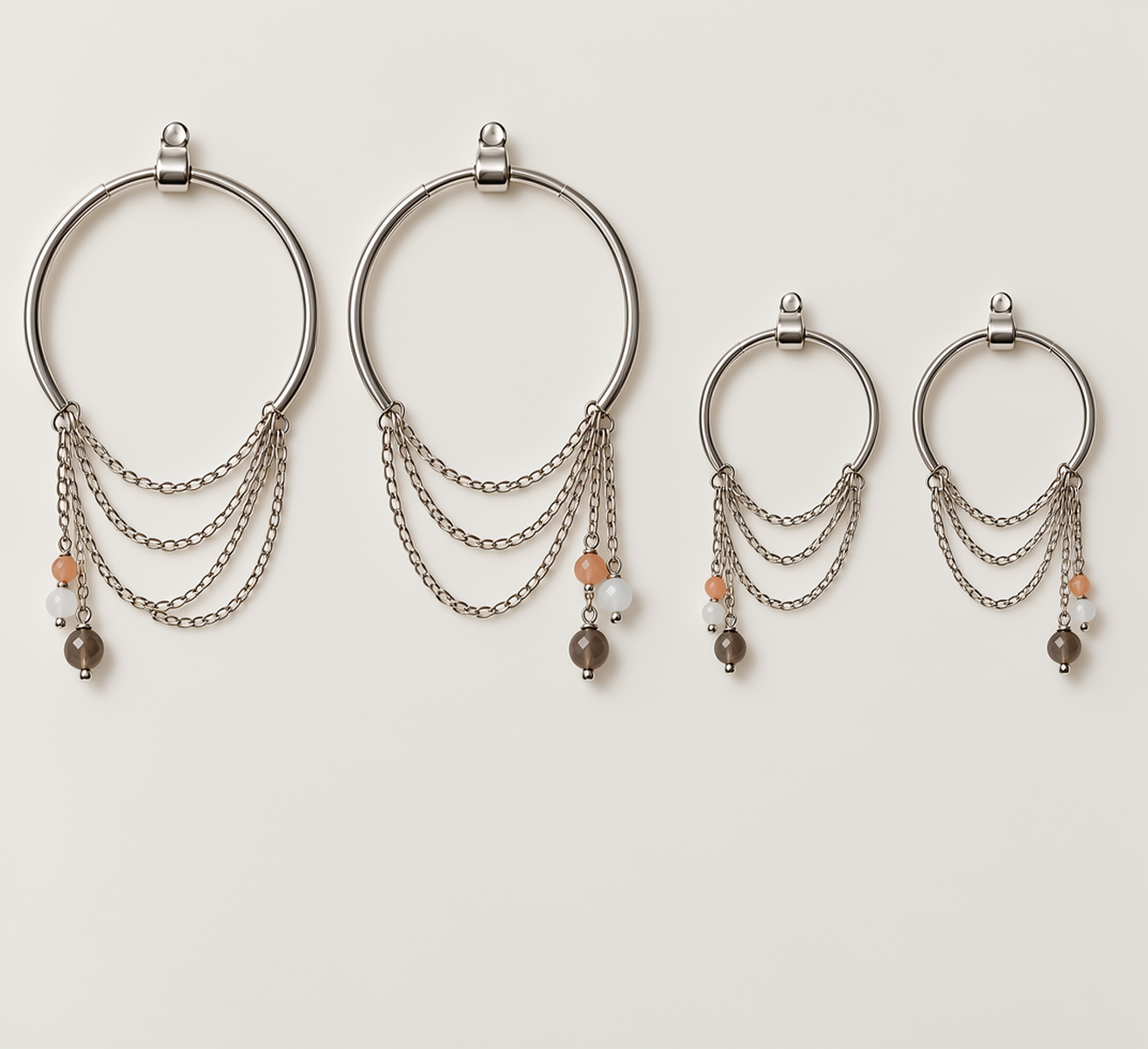Zorya sterling silver hoop earrings with cascading chains and gemstone drops worn on ear