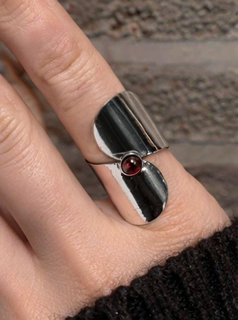 Silver cabochon gemstone statement ring worn on hand
