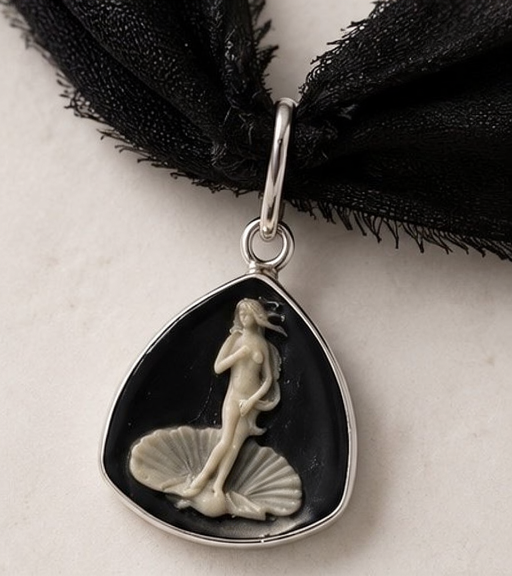 Close-up of Venus cameo pendant in sterling silver setting on black silk choker