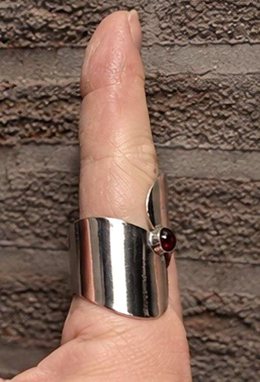 Silver cabochon gemstone statement ring shown on finger
