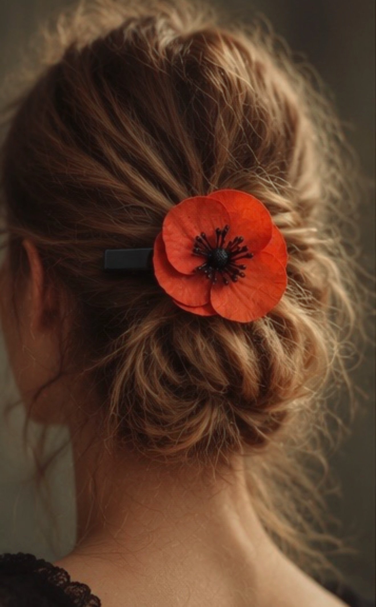 Poppy hair clip in hair bun.jpeg
