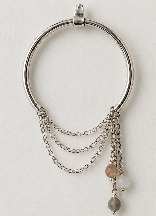 Zorya sterling silver hoop earrings with cascading chains and gemstone drops worn on ear