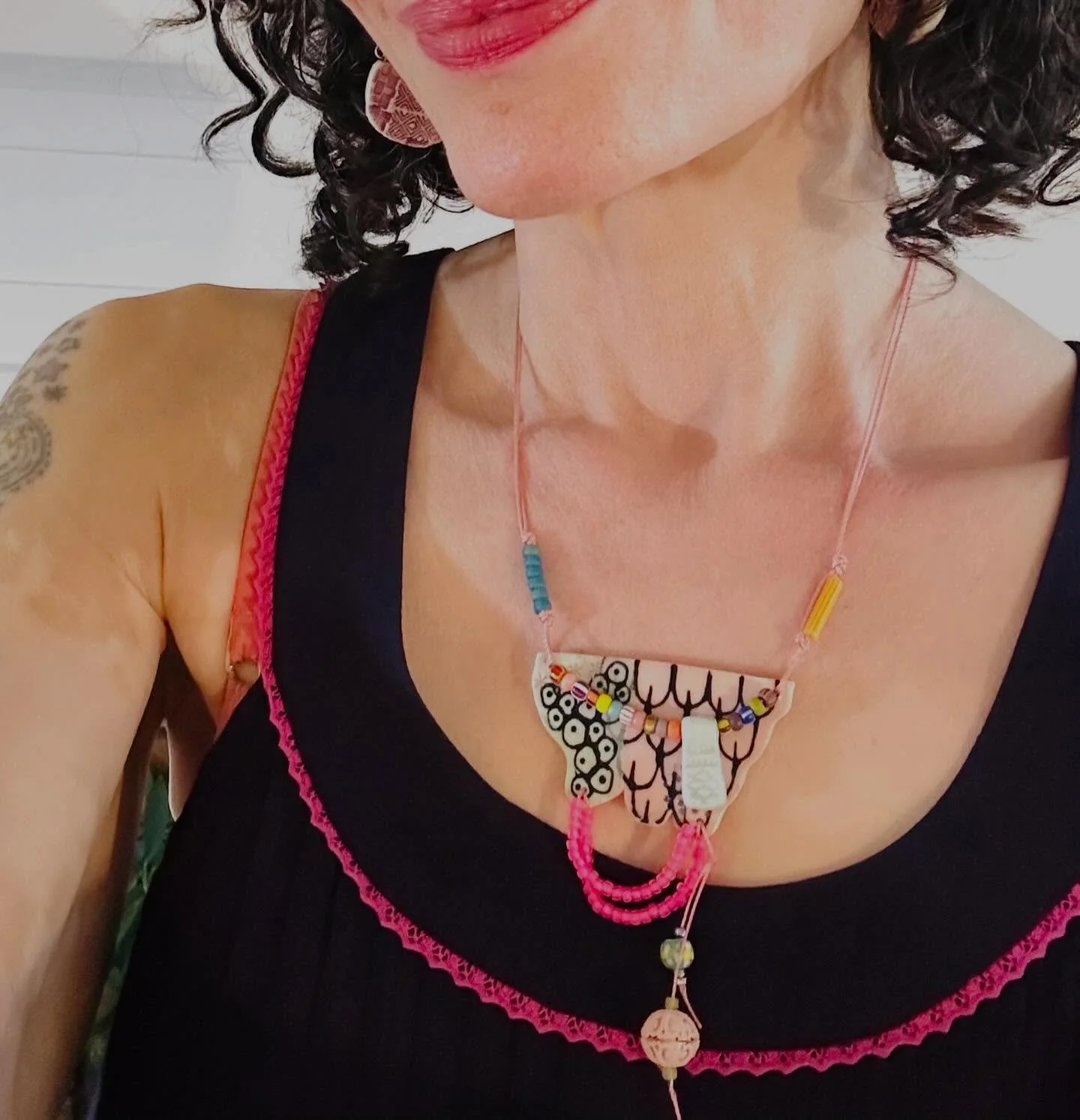 Oh, so much to explore. I do love this combo of techniques and materials and of course colors. Ceramic with beads. 💜🩷. #ceramicjewelry #jewelrydesigner #artist #artjewelry #handmadejewelry