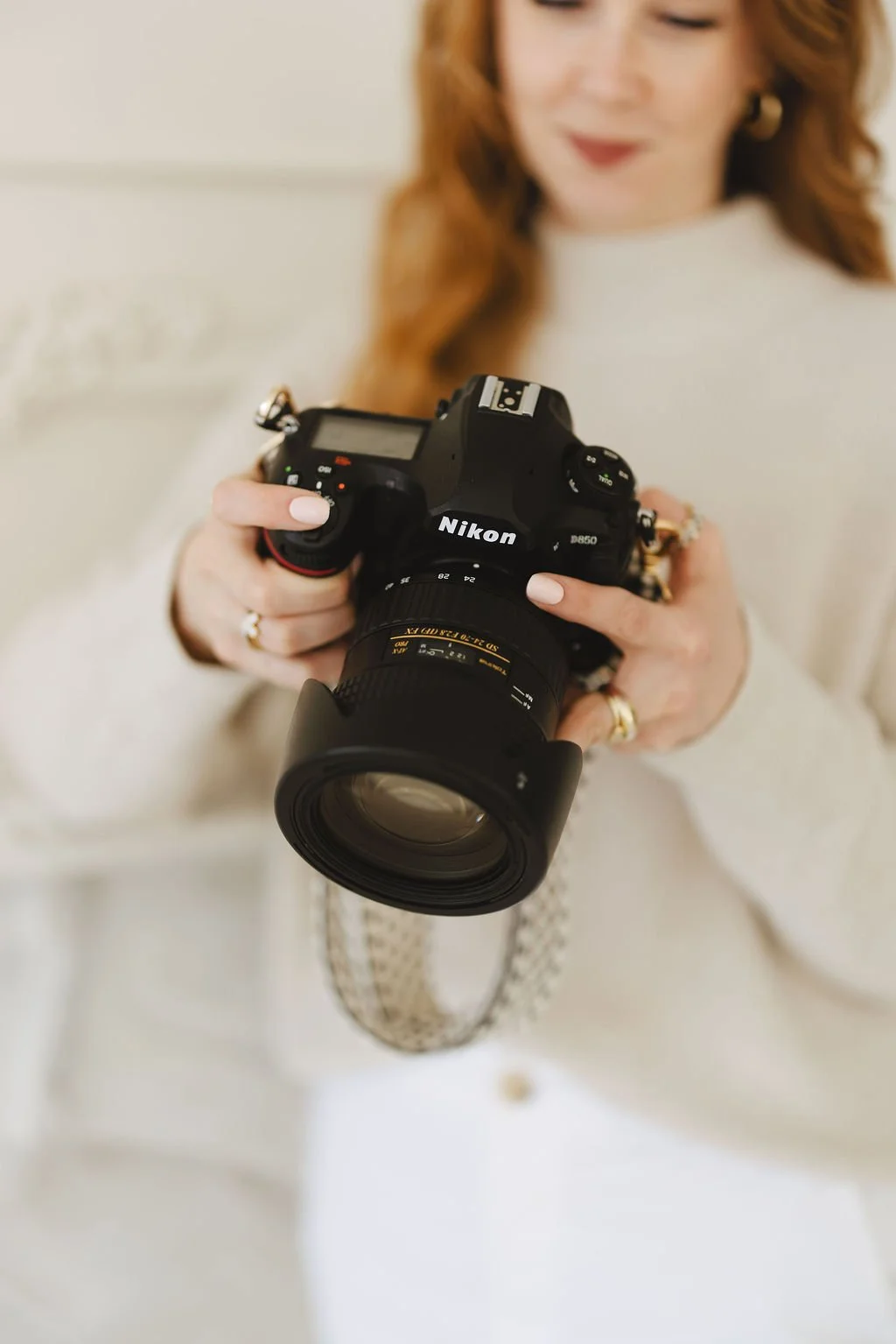 photo of zoey holding a nikon camera