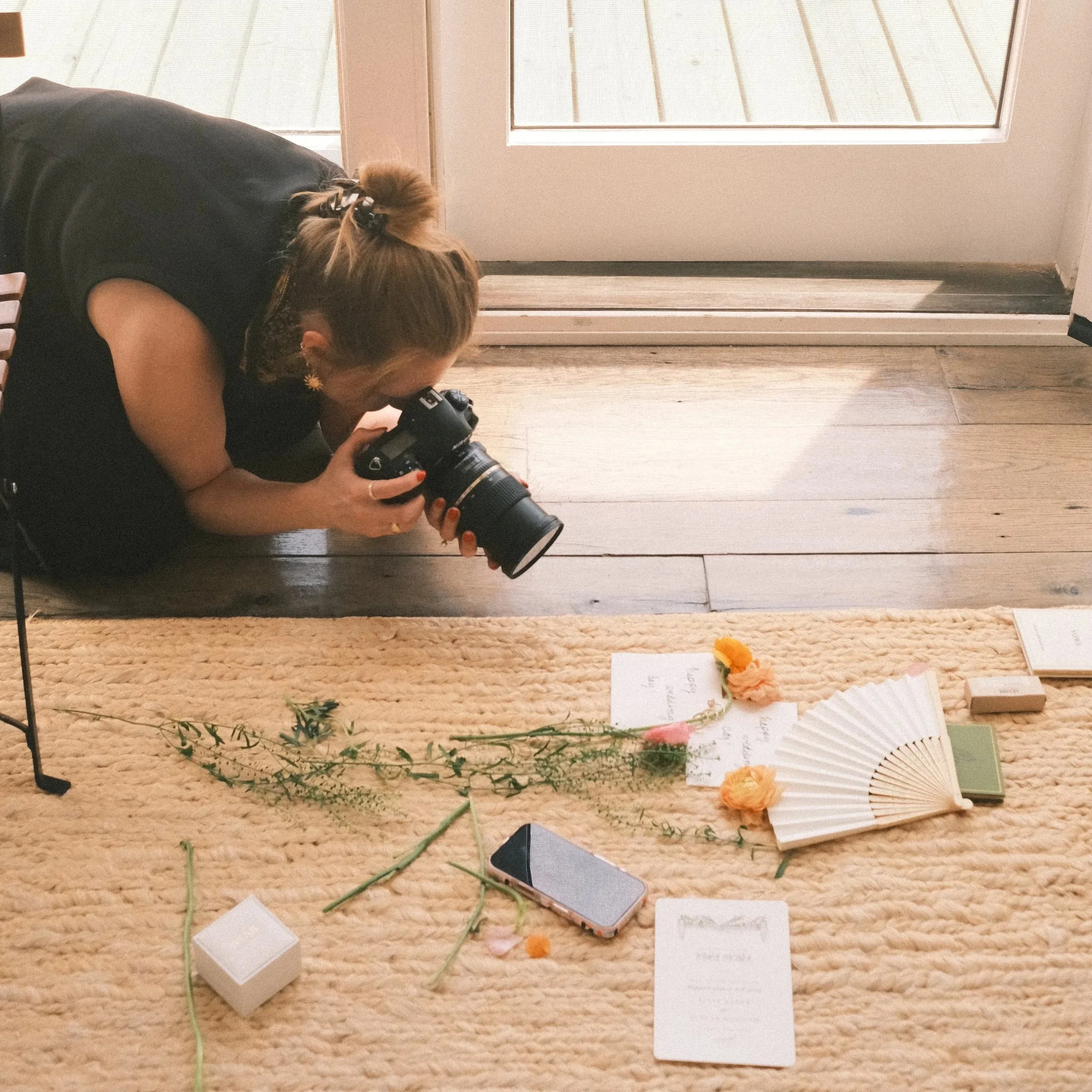 photo of zoey taking detail shots during a wedding
