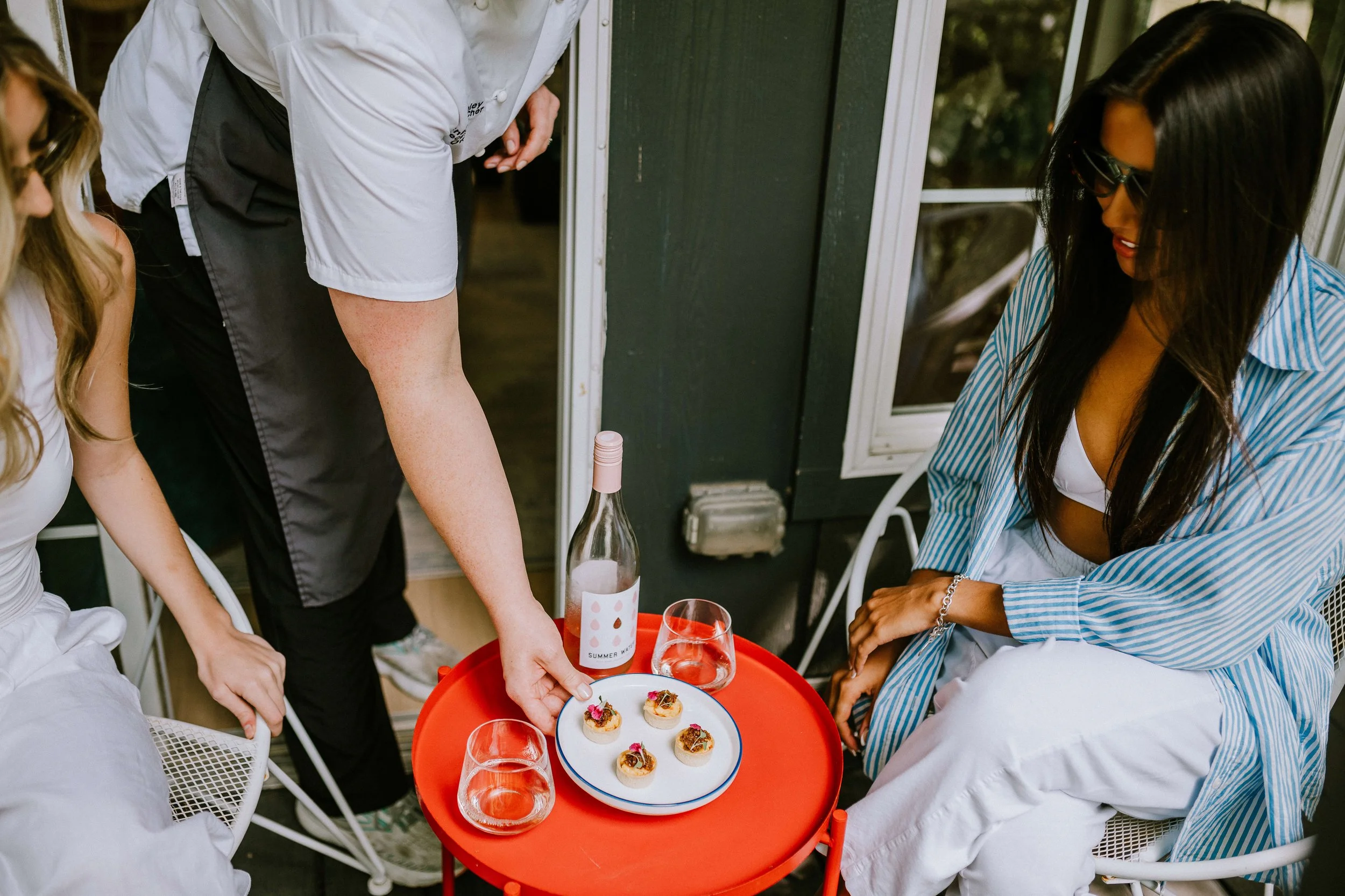 personal and private chef ashley serving guests a private dining experience for airbnb and vacation rentals in austin texas