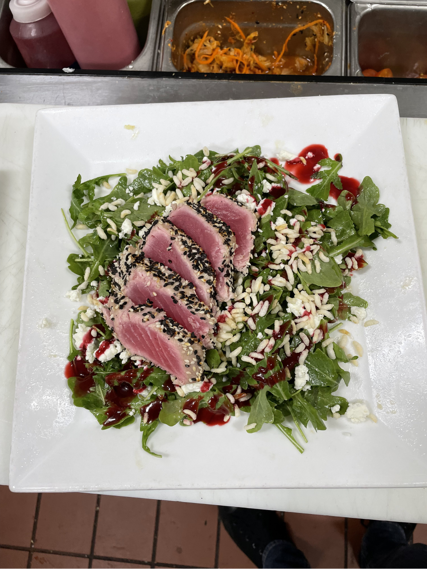Seared tuna on a bed of rice and arugula