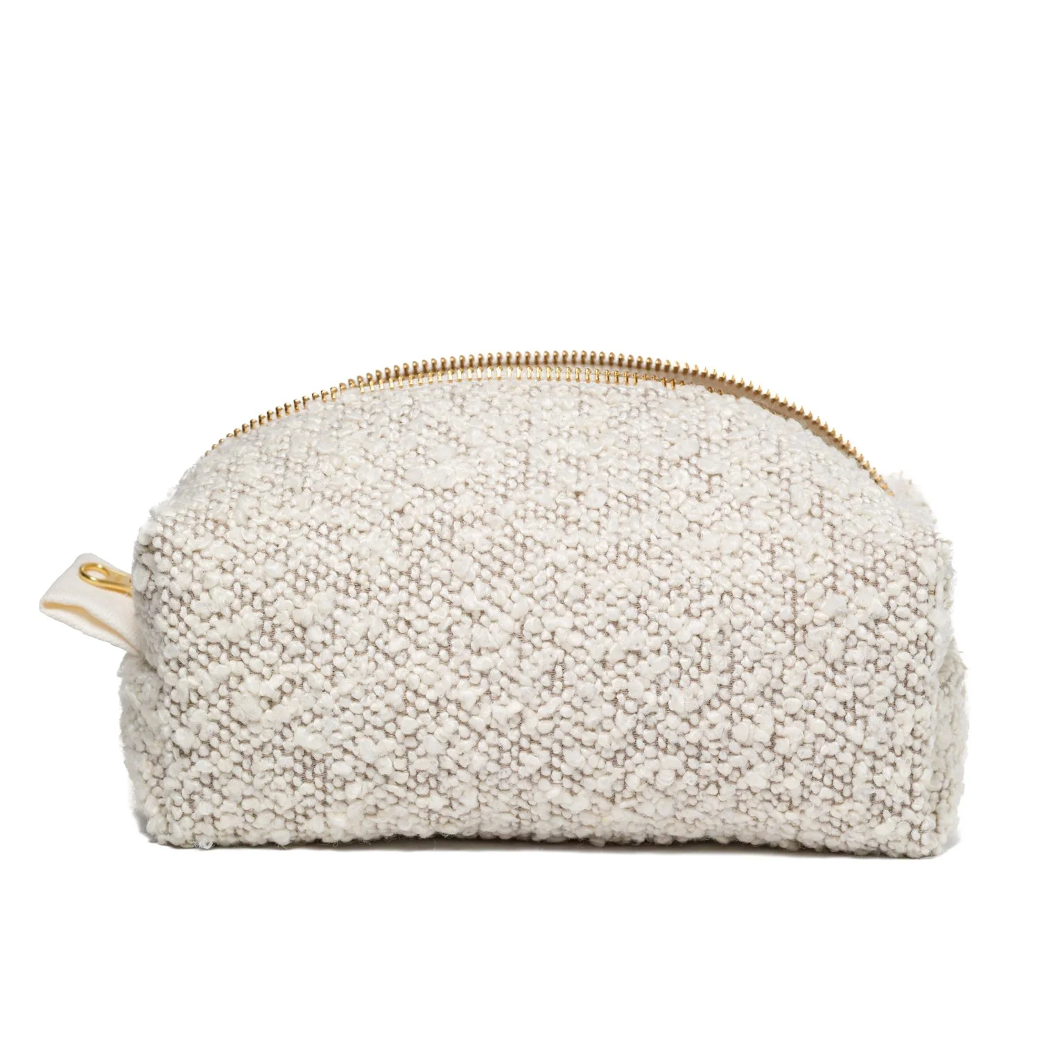Hvit, fluffy kosmetikkpung eller toalettmappe med gullfarget glidelås.