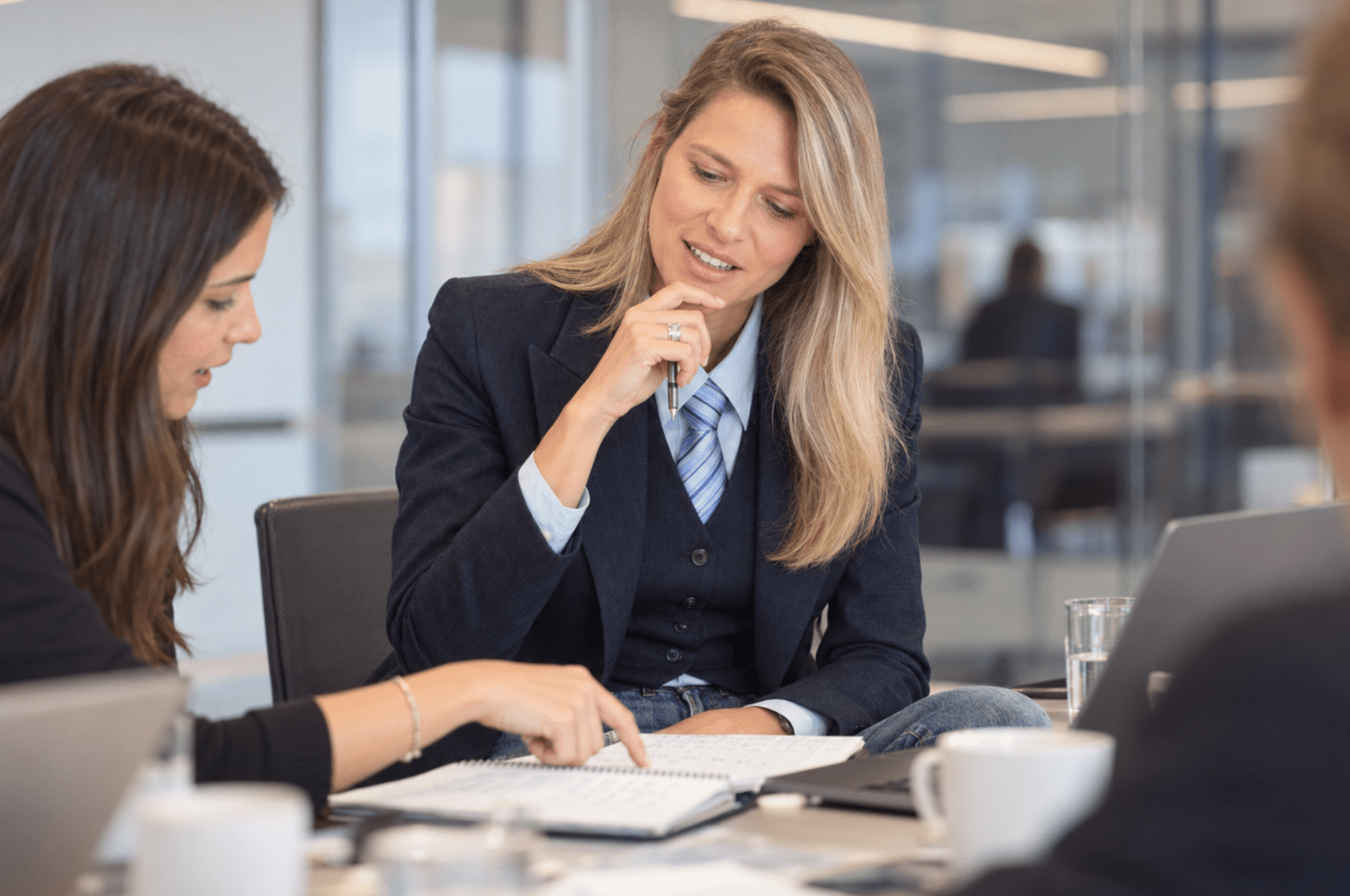 Professionals reviewing a report together