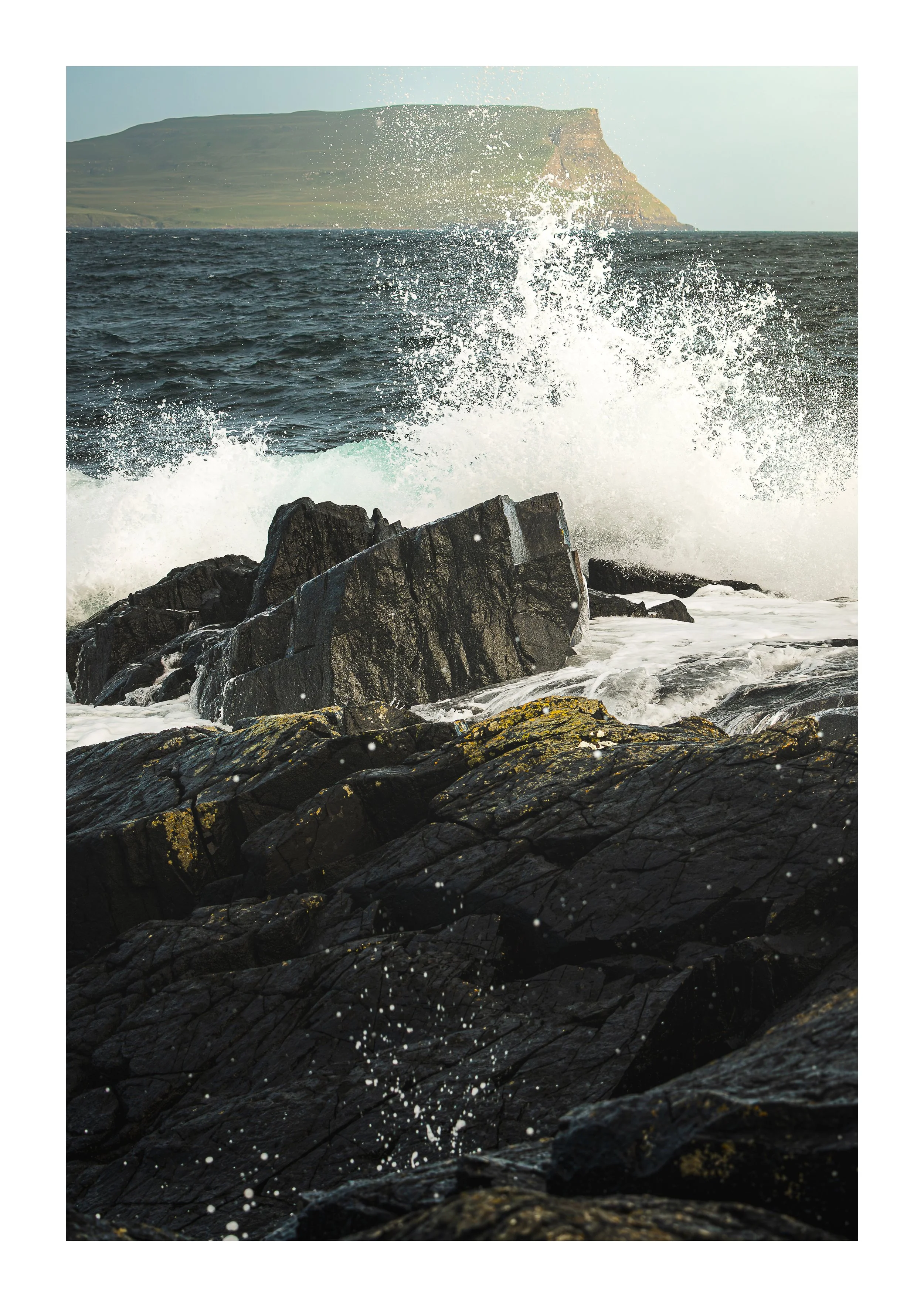 A Picture of a wave crashing over the rocks