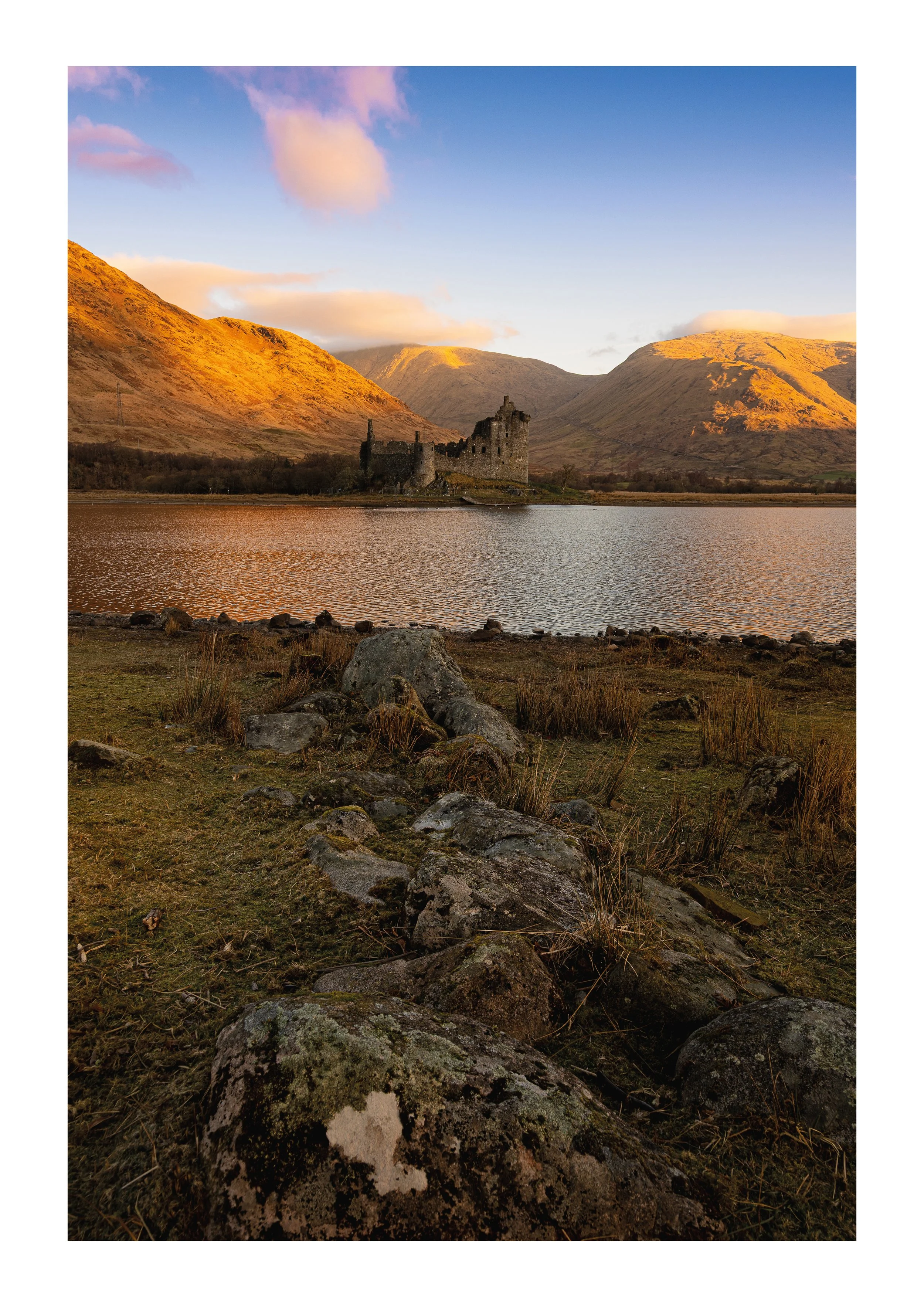 A framed picture of Kilchurn Castle in the Morning Glow
