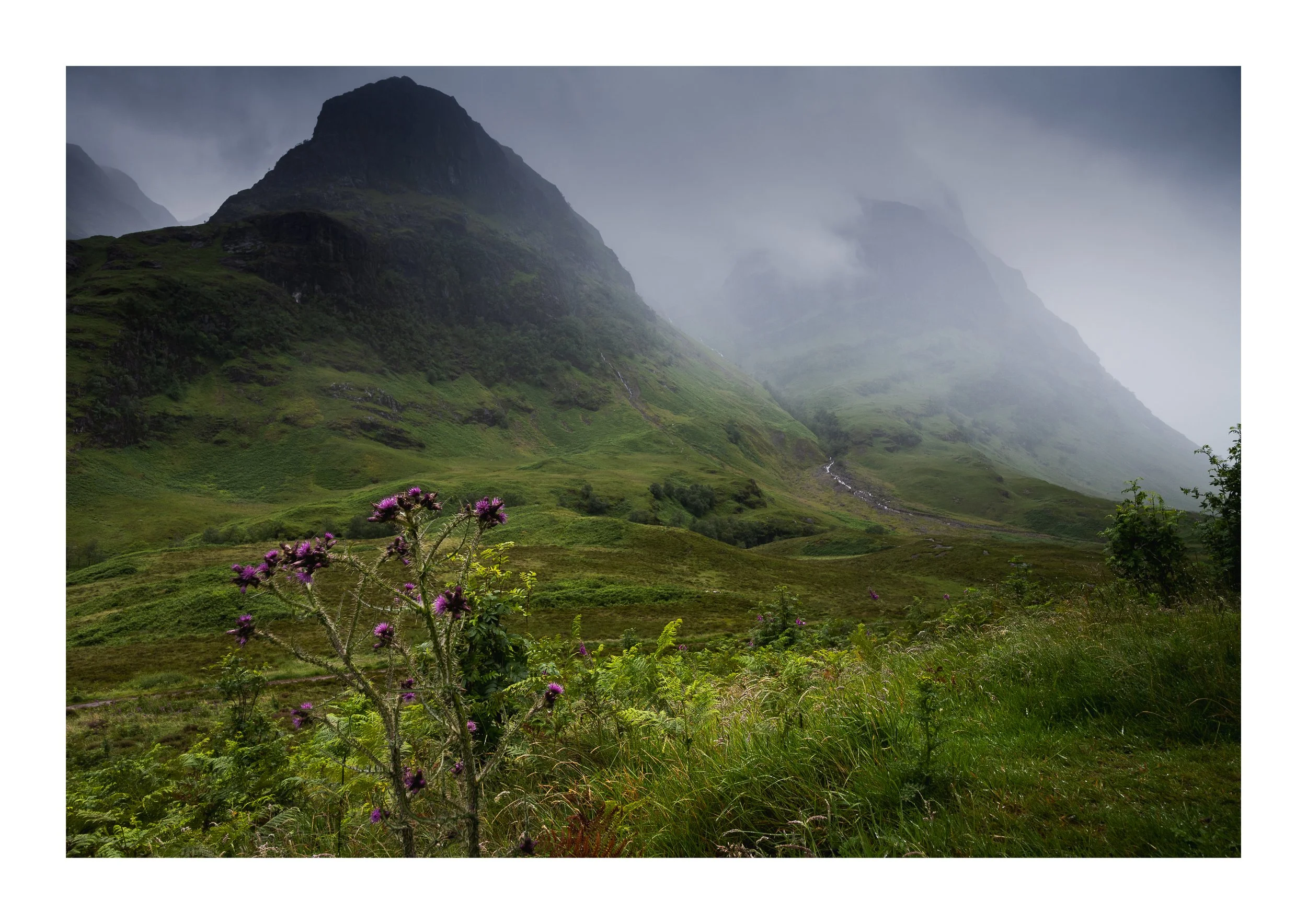 A picture of the three sisters of Glencoe under moody skies