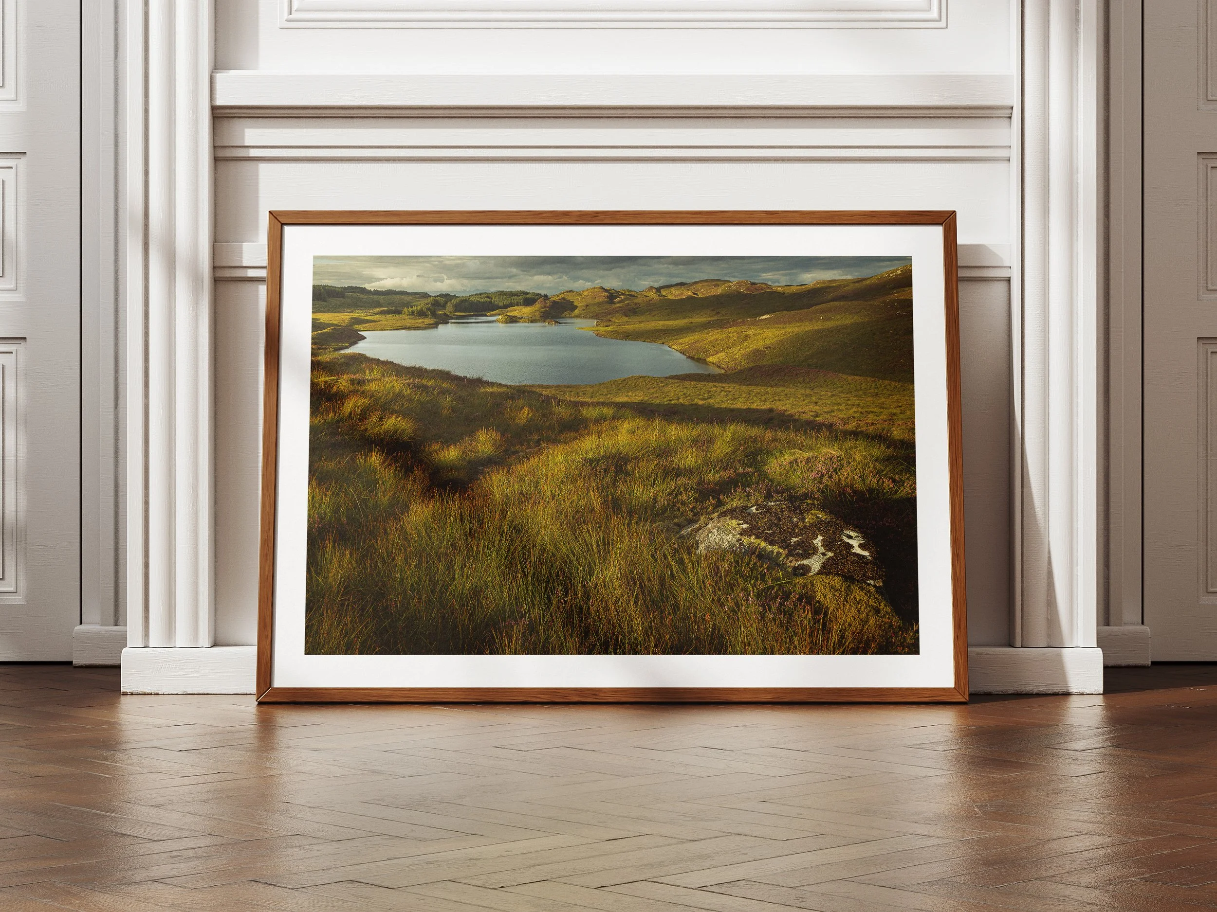 A framed picture of a hidden loch in the Scottish Highlands