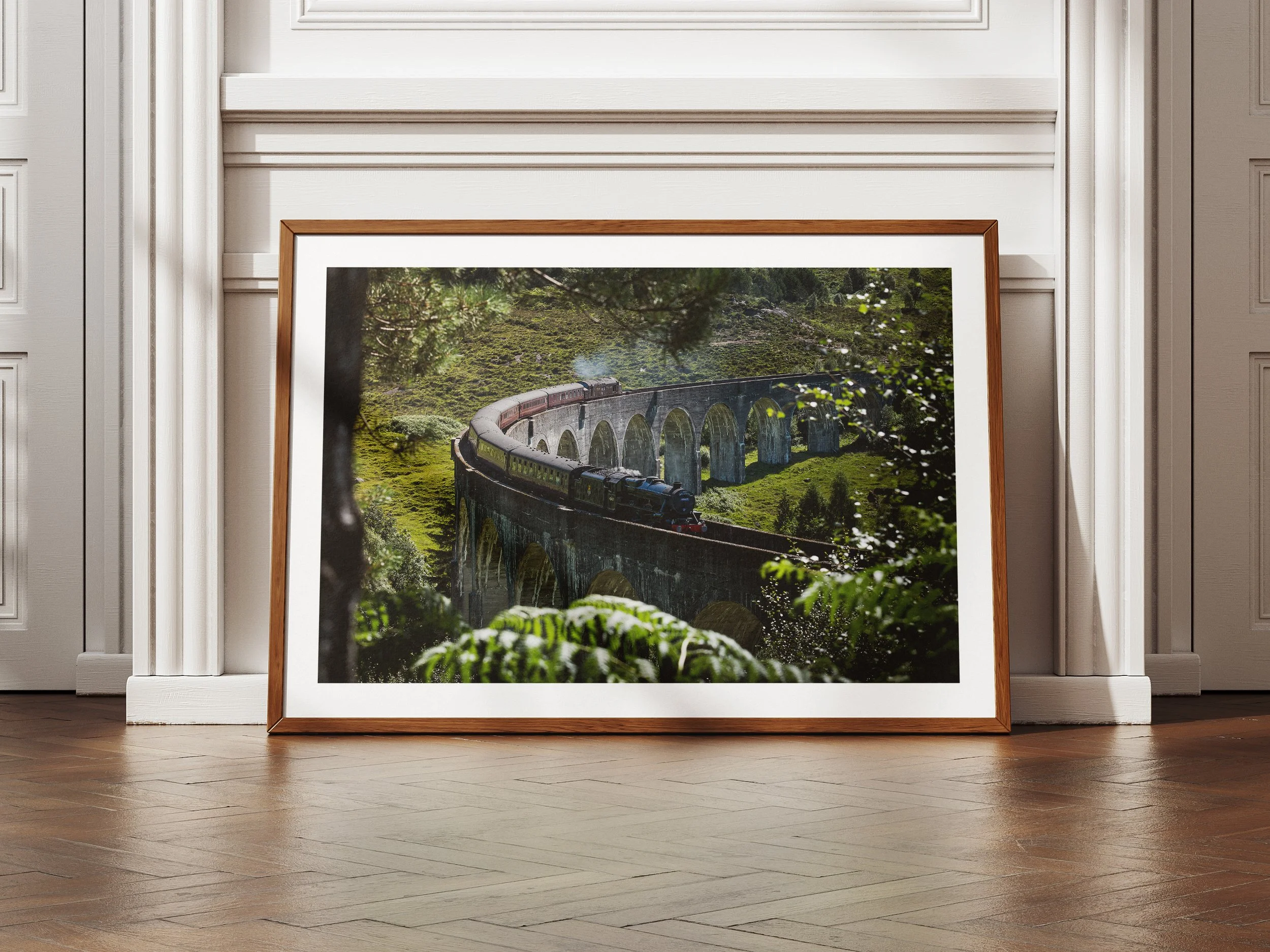 A framed picture of the Jacobite Steam Train on the Glenfinnan Viaduct