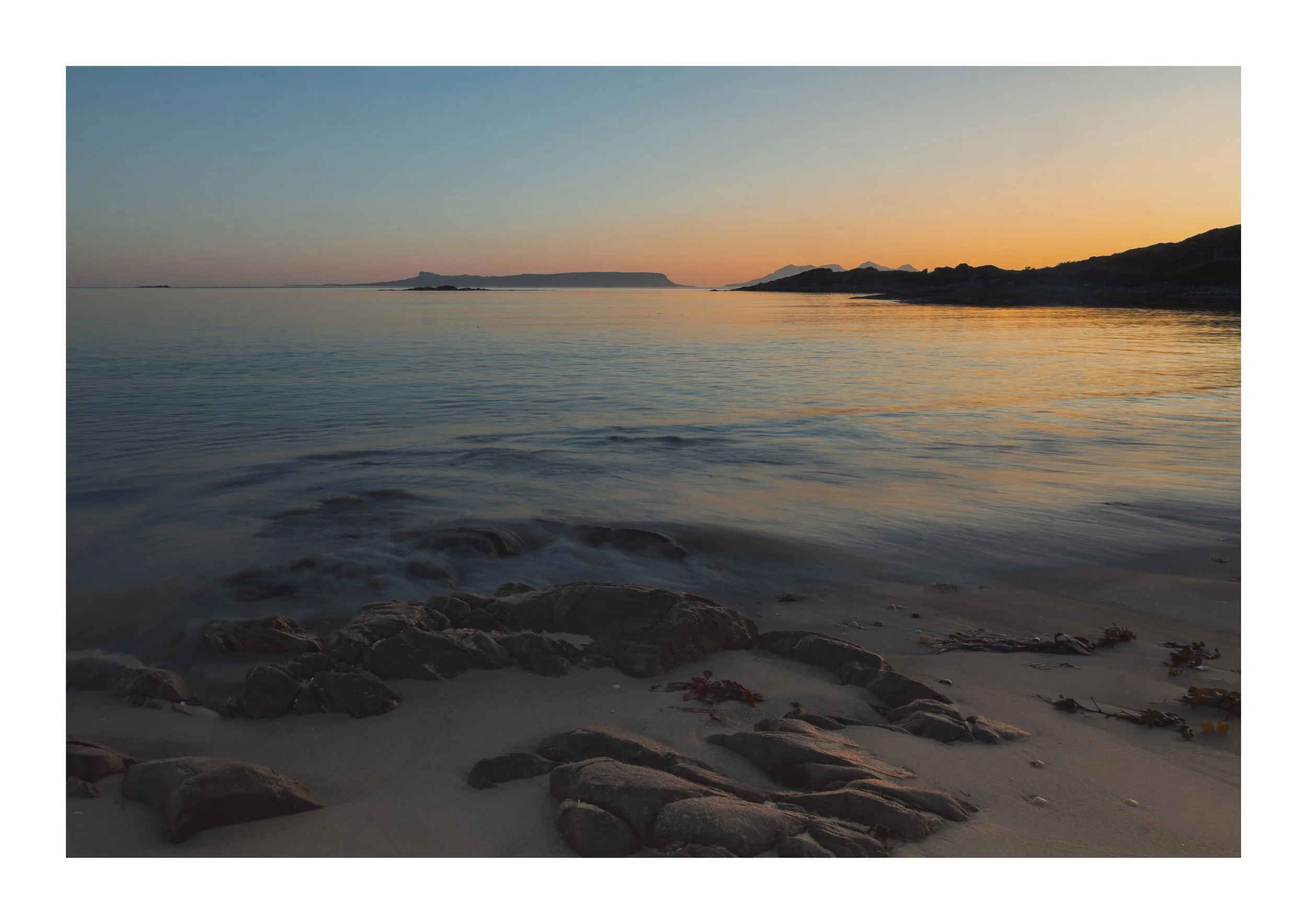 A picture of sunset over the sea at Silver Sands Beach