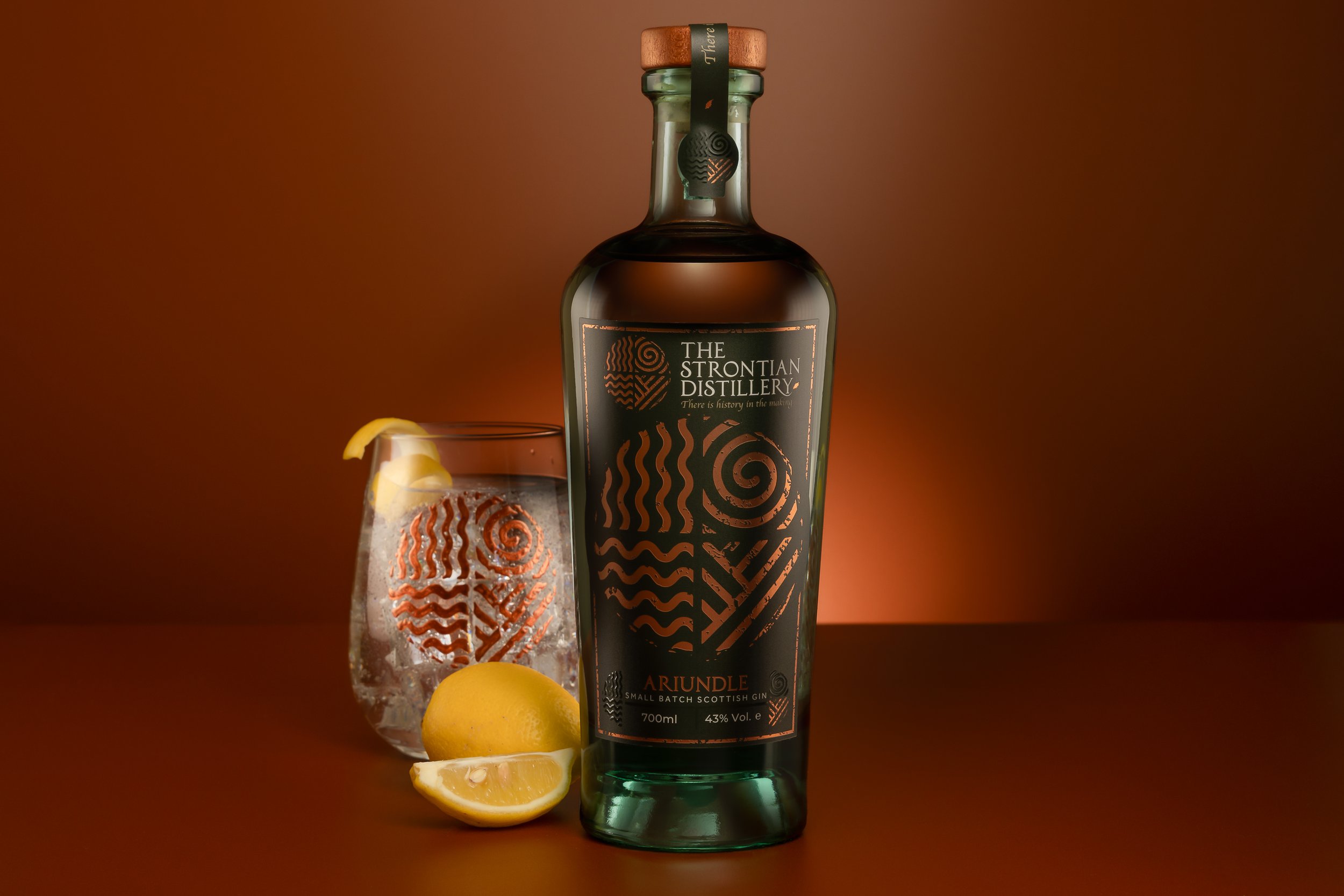 Strontian Gin Ariundle bottle photograph with Strontian Gin Branded Glass and lemon