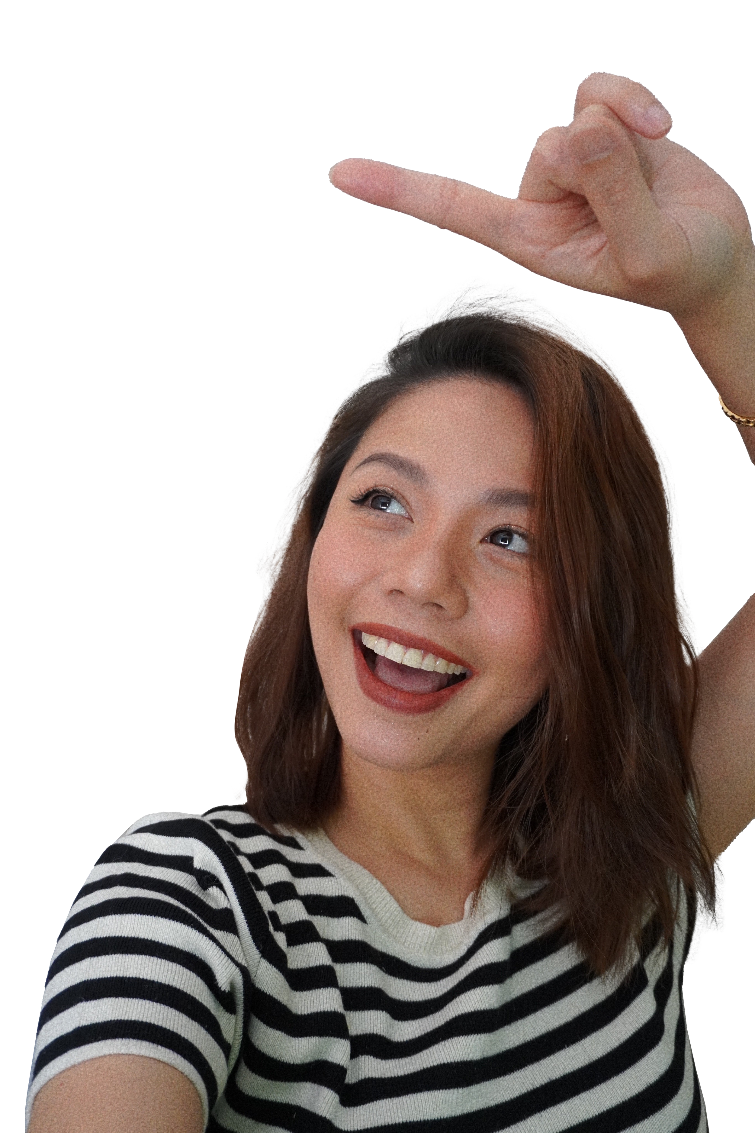 A young woman with shoulder-length brown hair, smiling and looking upward, wearing a black and white striped shirt, with a hand visible above her head pointing or making a gesture against a black background.