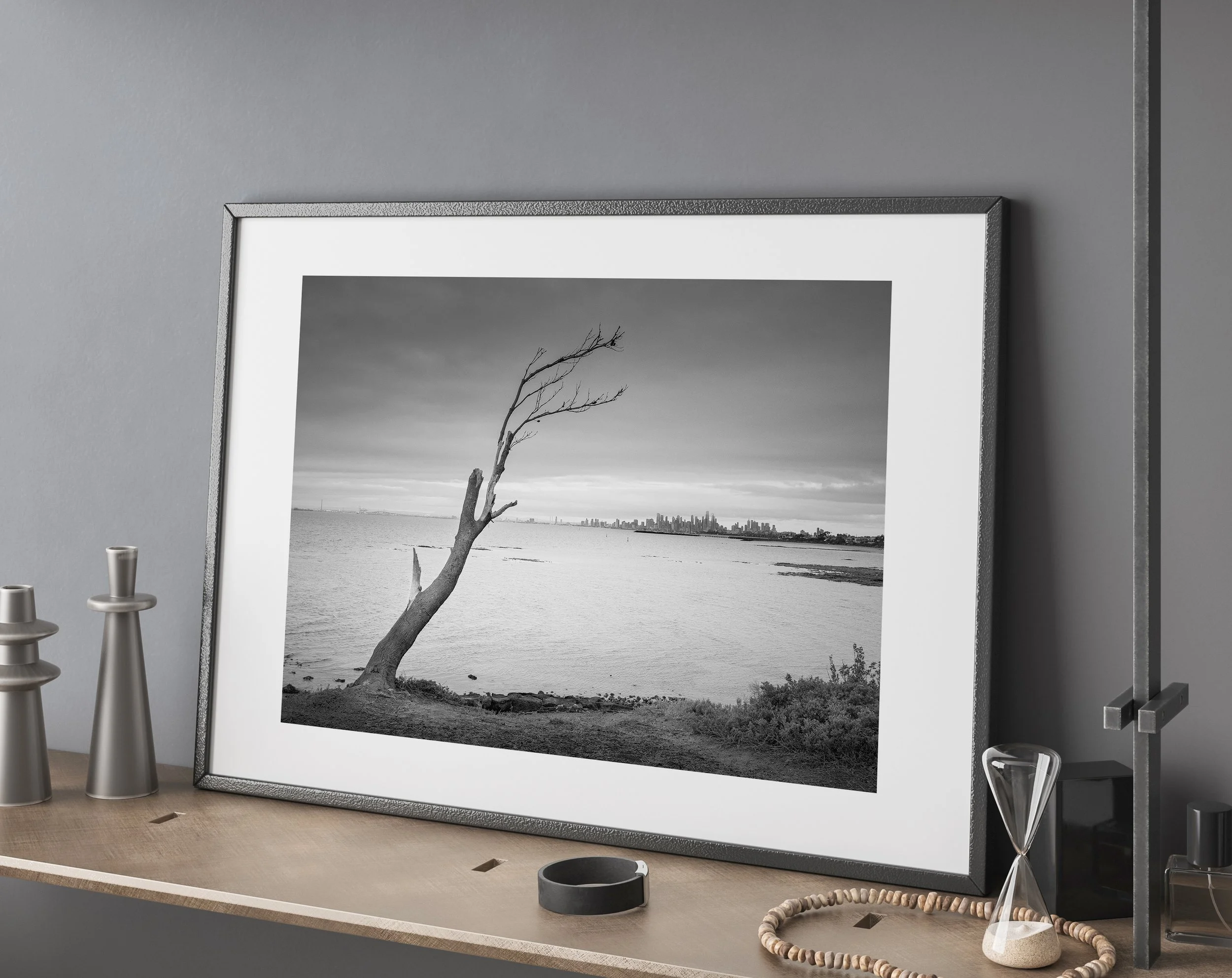 Limited edition black and white seascape print of Brighton Beach, Melbourne. Lonely tree at sunrise with skyline. Fine art giclée on Hahnemühle Photo Rag Pearl.