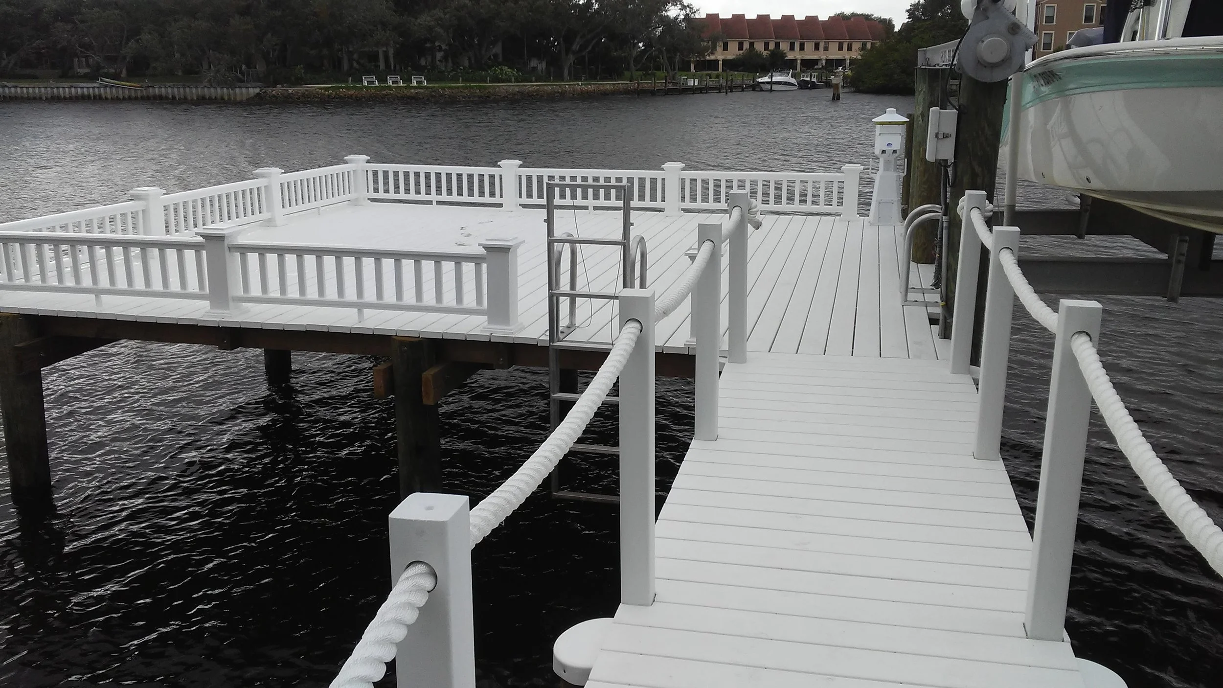 Dock with rope railing and deck railing