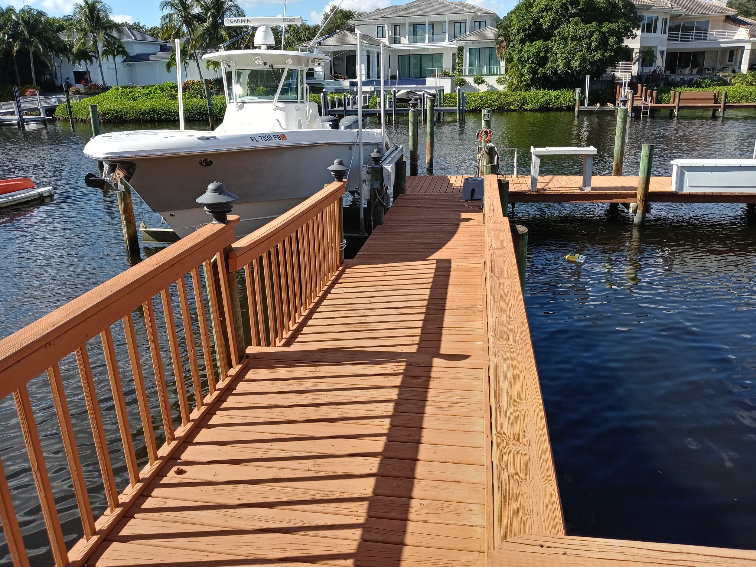 Cedar dock with railing and boat lift