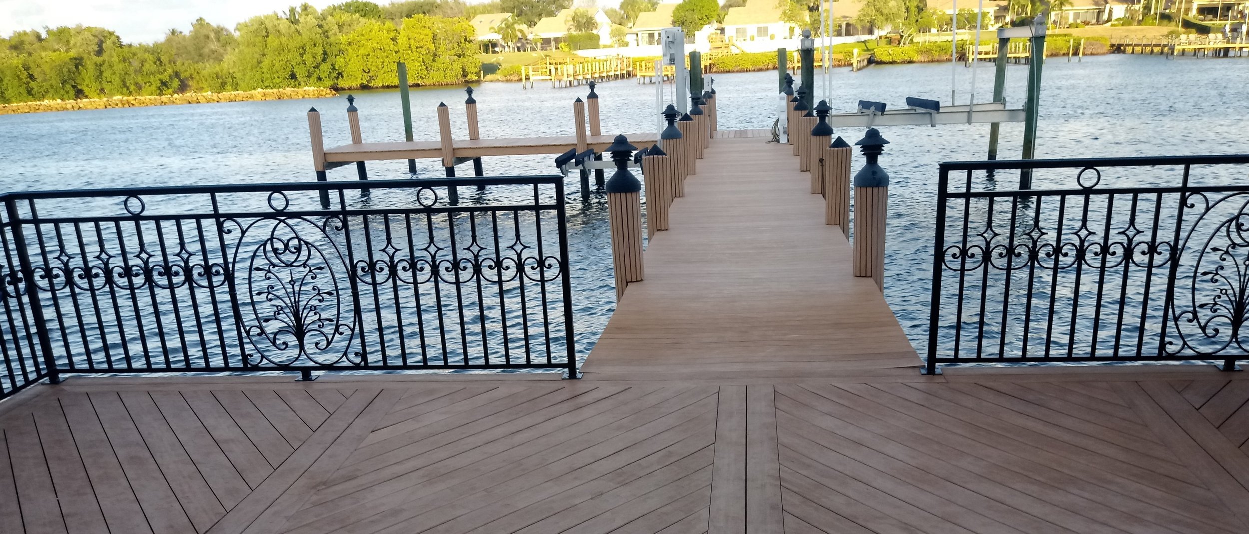 Dock with boat lift and decorative railing