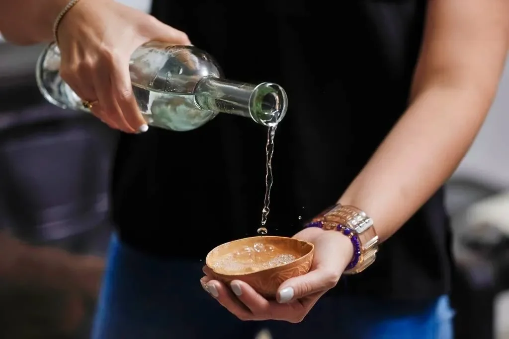 mexico-city-pouring-mezcal.webp