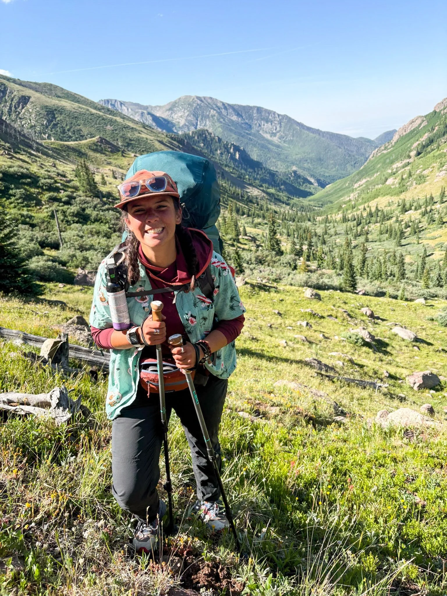 college girl backpacking in Colorado rocky mountains