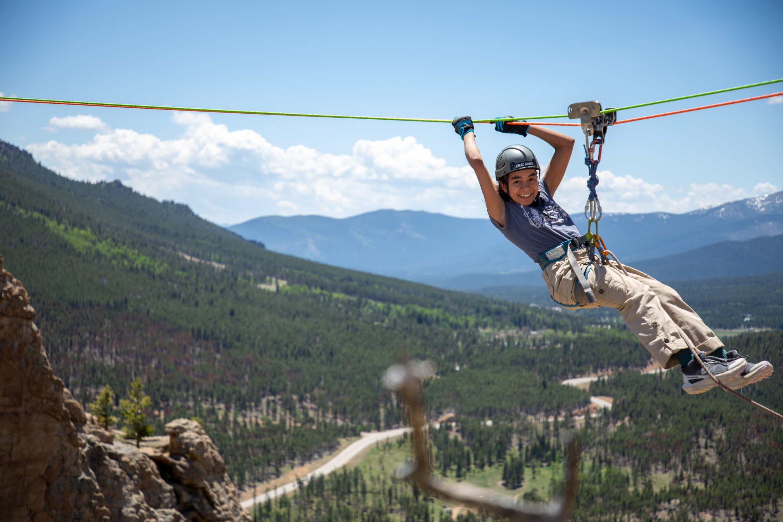 a high school girl on the Tyrollean traverse