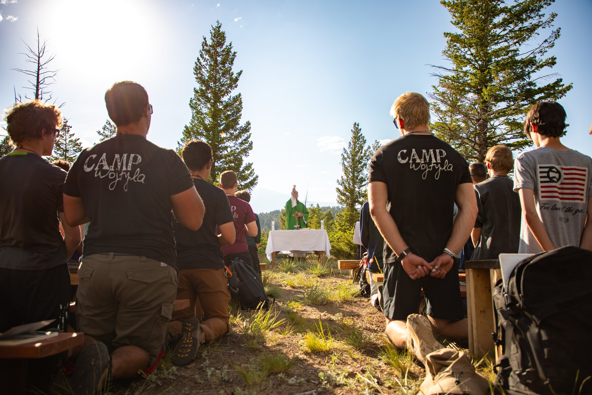 Catholic Mass outdoors in the Rocky Mountains at a Catholic summer camp in Colorado