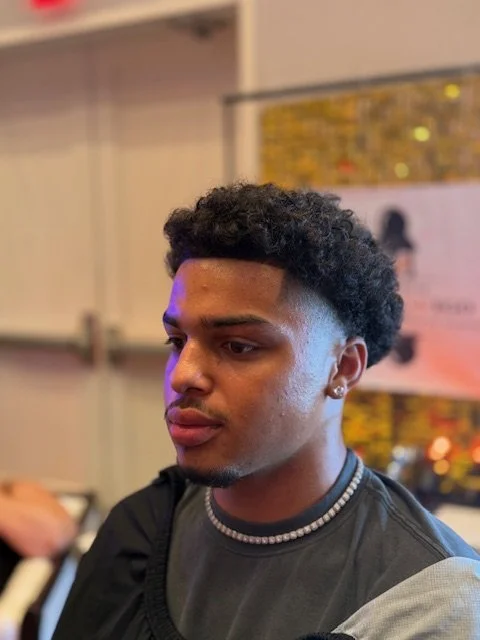 “FadezByBoda barber trusted by Iowa Hawkeye athletes for game-day fades”