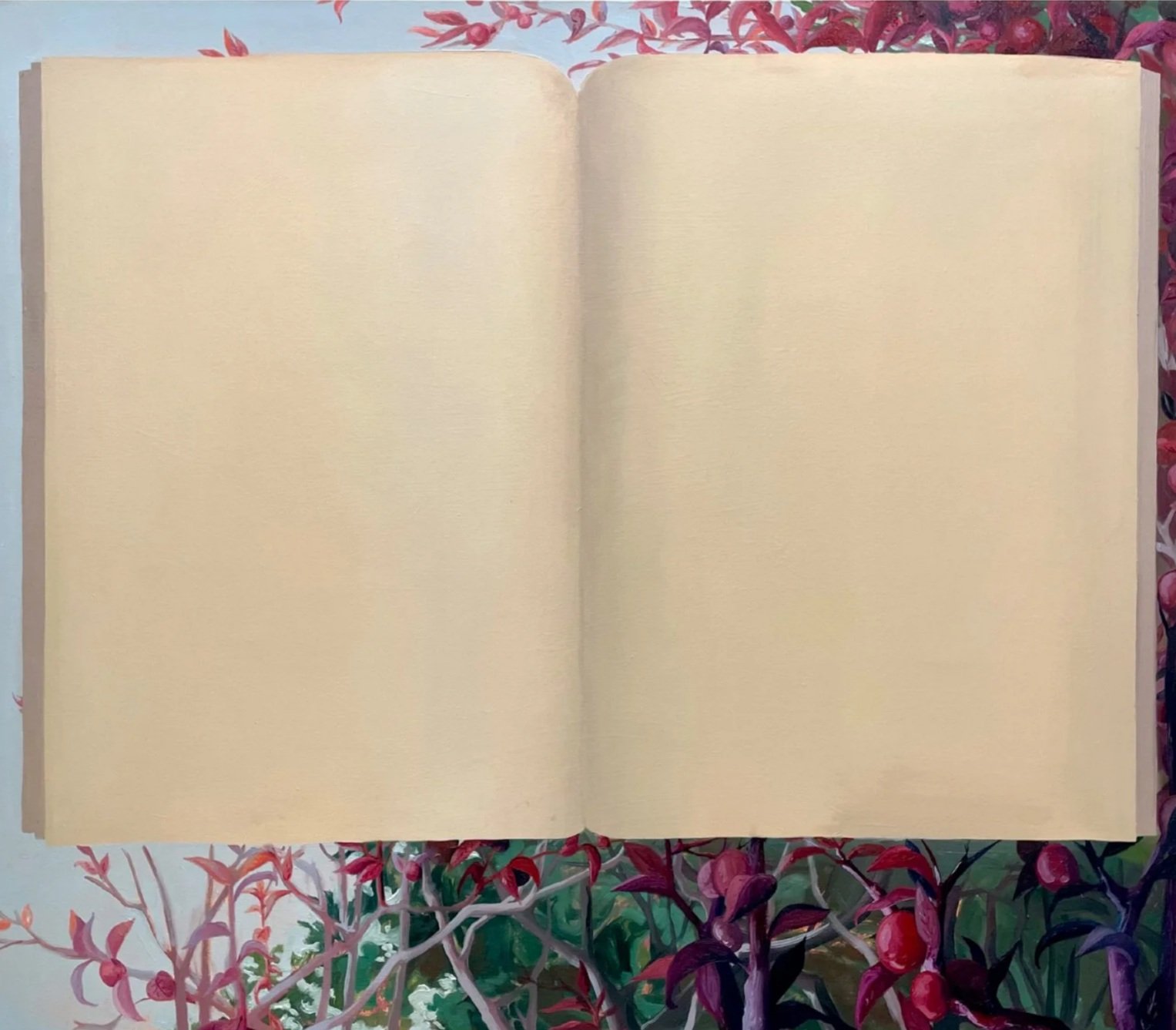 Open blank notebook placed on a colorful, leafy tablecloth background.