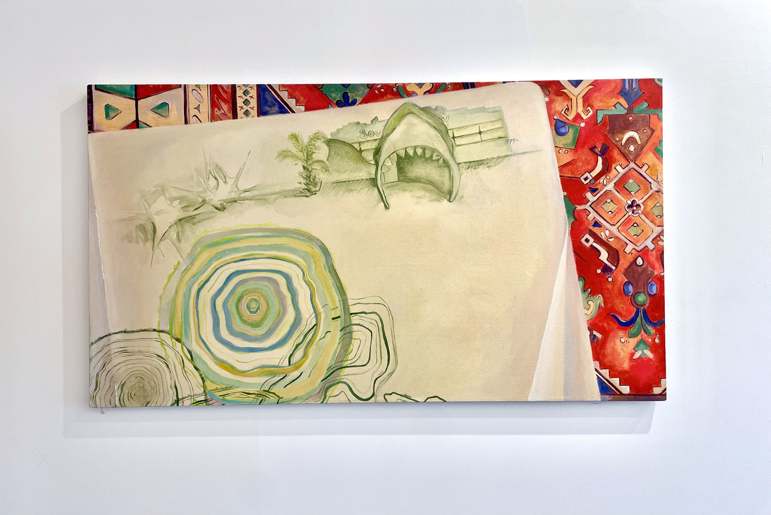 Mixed media artwork on canvas featuring colorful patterns, a stylized spiral, abstract shapes, and a shark with its mouth open at the top center, framing a background of vibrant textile design.