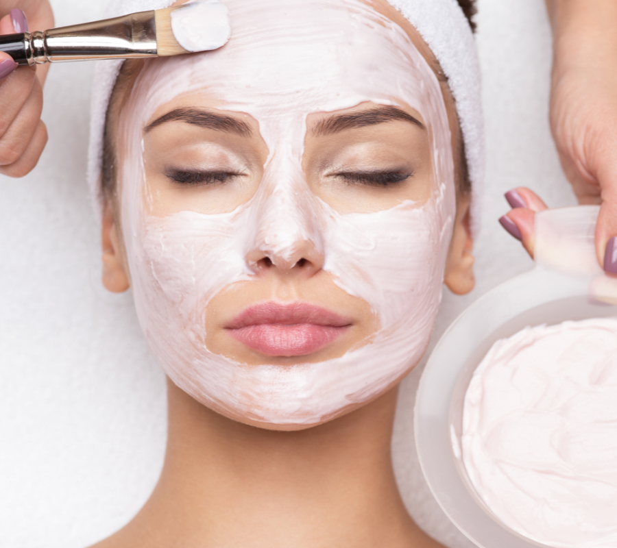 woman's face with facial treatment mask