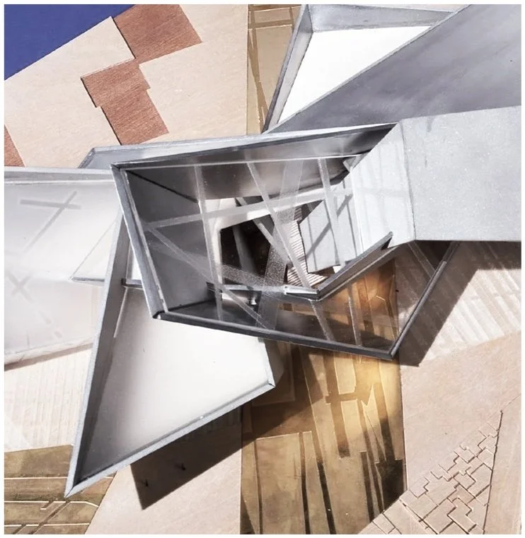 Looking down into a hand-made model of a proposed architecture project for the Extension to the Denver Art Musuem.