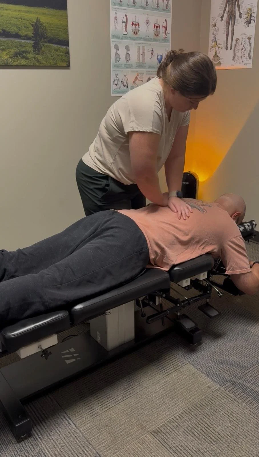 Man being adjusted by chiropractor